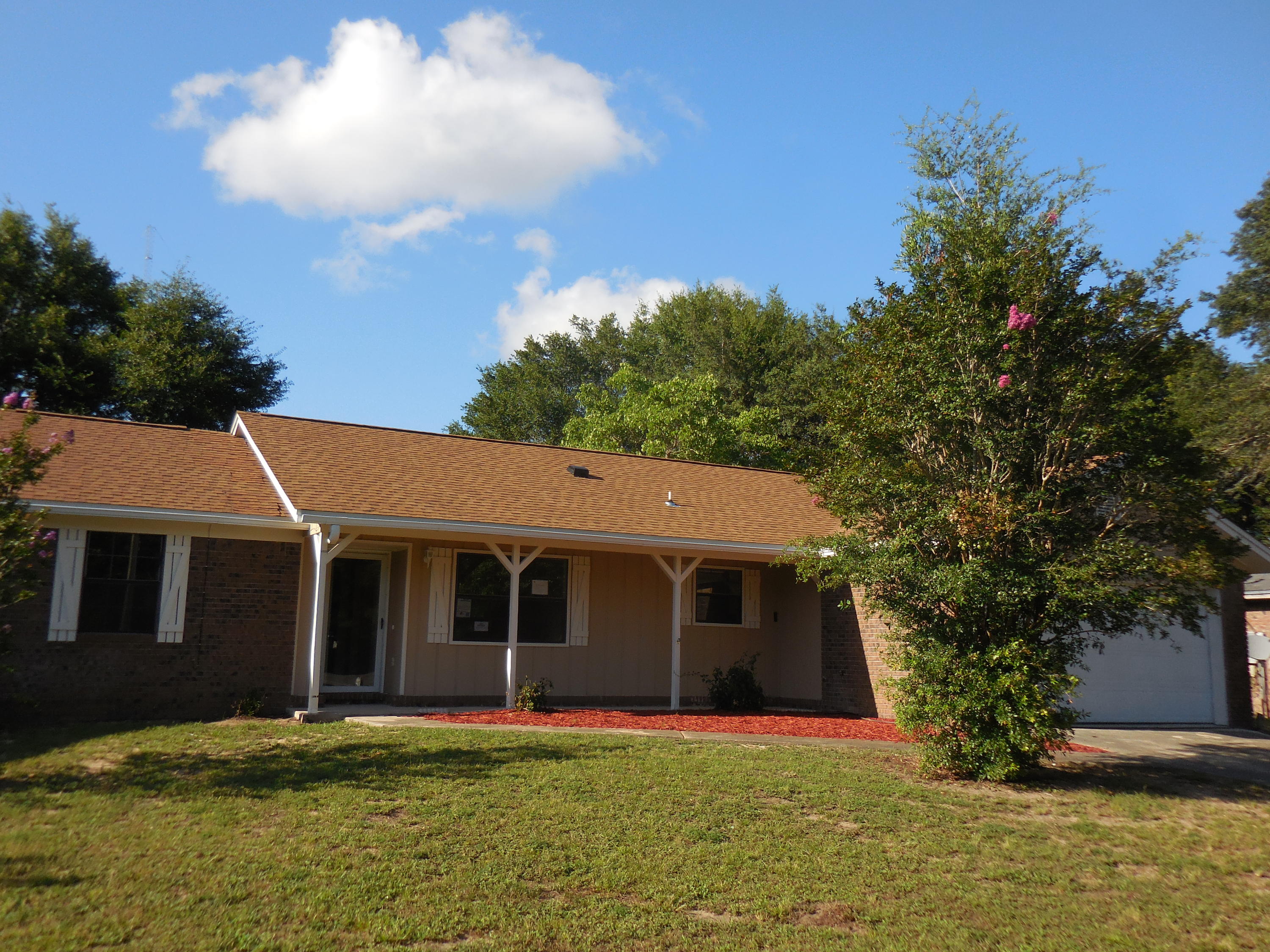 REO. Wonderful 3/2 home with a spectacular fireplace in the living room! There is also a formal dining room and the kitchen features a convenient pantry and a new stainless steel dishwasher and stove/oven. This home features a split bedroom floor plan. The master is off the kitchen with 2, yes 2, closets-one a walk-in and a private bath. The other two bedrooms and guest bath are down the hall from the living room. The 2 car garage has laundry hook-up, pull down stairs for attic storage, and a brand new garage door. The roof is brand new and the home has been newly painted inside and out. There is also new carpeting and vinyl flooring!