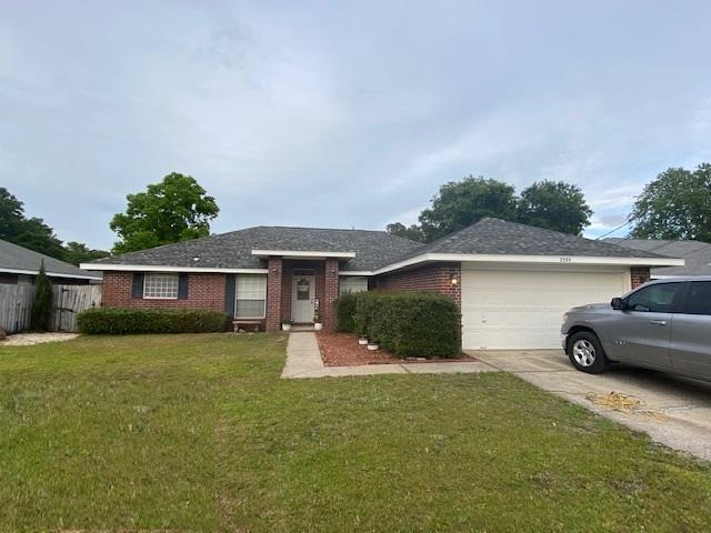 This Lovely 3 bedroom 2 bath home has a Brand New Roof!!!! Located conveniently close to Navarre Beach and Hurlburt Field! A Pretty Tiled Foyer welcomes you at the entry. Next to Foyer, there is a Formal Dining Room on the right and a Bonus Room on the left that can be used for anything you desire! Home School/Office/Playroom etc! The Living Room is large with lots of wall space and a Corner Fireplace! The Eat-in Kitchen has White Cabinets, Stainless Appliances, Corian Solid Surface Countertops and a Breakfast bar! The Master Bedroom is spacious and has a Dreamy Bathroom with double vanities, two walk-in closets, a Separate Shower and a Garden Tub! This home has a split floor plan with cathedral ceilings in the main living area.