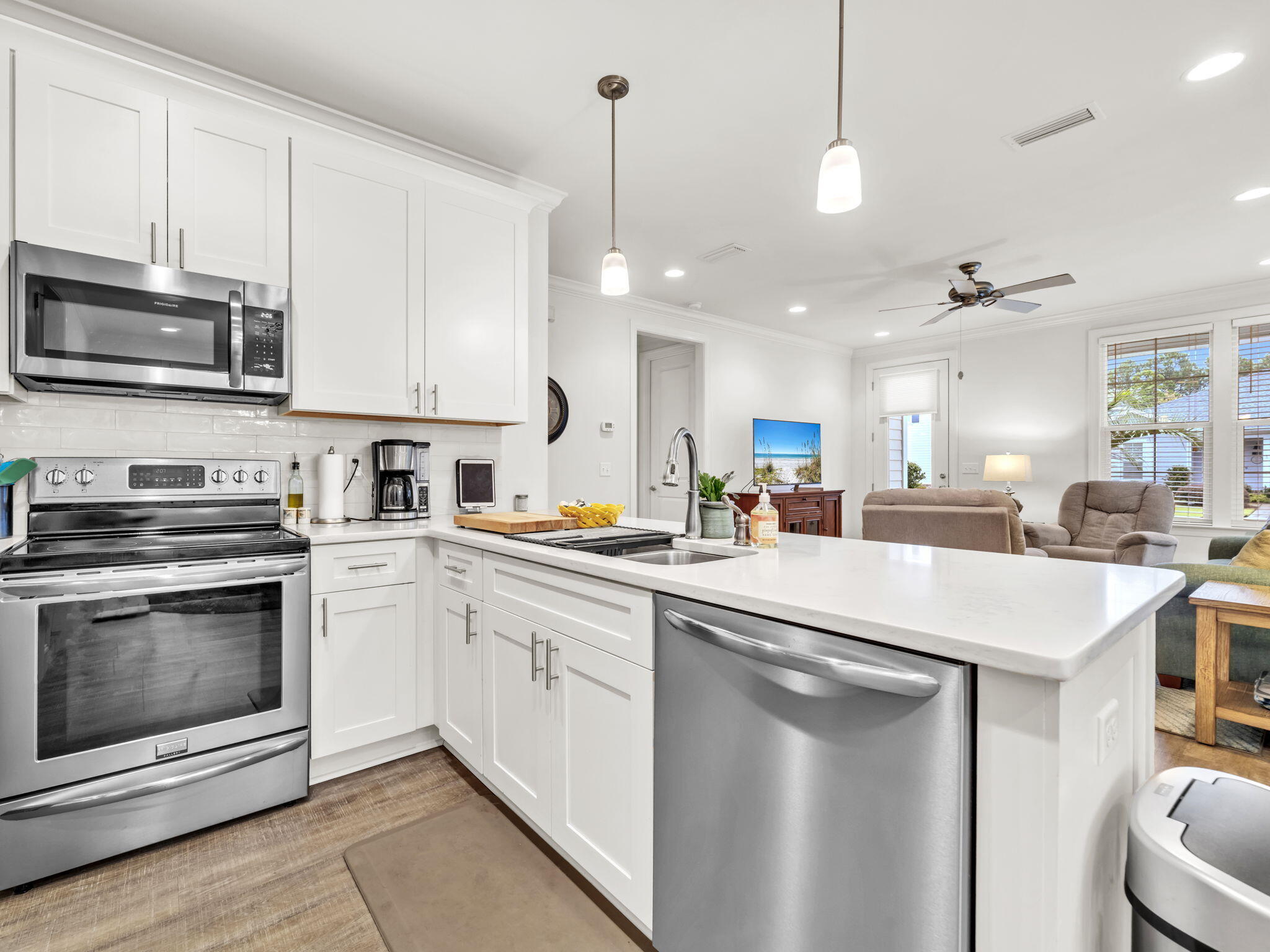 This beautifully designed Ashley plan located in Church Street Village is a single-story home featuring 2 bedrooms, 2 baths, a versatile office, and a 1-car garage. Perfect for anyone downsizing, relocating, or seeking a low-maintenance coastal retreat, the floorplan combines modern comfort with elegant finishes. The office is a flexible bonus room, large enough to function as a guest space with a daybed if needed. The spacious kitchen showcases quartz countertops, wood cabinetry, stainless steel appliances, and a large island, making it ideal for both entertaining and everyday living. Throughout the home, you'll find LV flooring, porcelain tile in wet areas, 9' ceilings, 8' doors, and recessed lighting. The master suite includes a walk-in closet, dual vanities, and a frameless tiled shower for a spa-like experience. Church Street Village is a gated community with landscaped grounds, sidewalks, a pool, fitness center, clubhouse, and dog park, with Phase III featuring larger lots and expanded amenities. Located just minutes from Highway 98 and Scenic 30A, the neighborhood offers quick access to the white-sand beaches of the Emerald Coast, top-rated schools, state parks, dining, and shopping. Whether enjoying the vibrant 30A corridor, exploring coastal dune lakes, or relaxing in the community pool, this home delivers bar-none quality and one of the best values in Santa Rosa Beach.