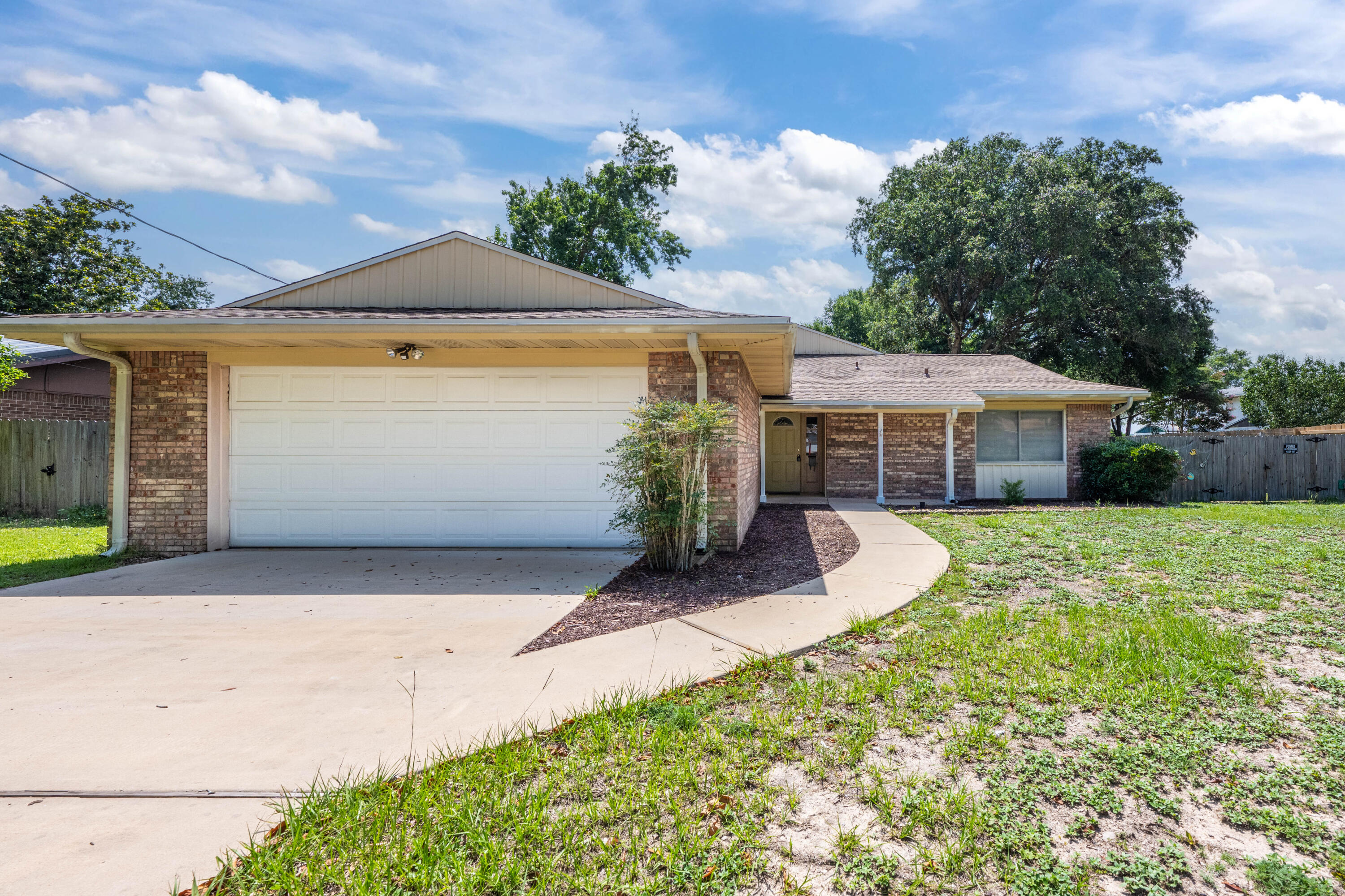 Water access in this community. This charming 4-bedroom home offers a spacious and inviting atmosphere. The split bedroom floor plan provides privacy, with the primary bedroom separate from the secondary bedrooms. New LVP in the bathrooms, kitchen, laundry room and bathrooms. Walls are also newly painted the roof was just added 2024, 2021 hot water heater, and new fixtures. New ceiling fans are strategically placed throughout the house for added comfort. The spacious kitchen features plenty of counter space and cabinets, along with a breakfast bar for quick meals or casual dining. The laundry room leads to the 2-car garage, which opens up to a large driveway capable of fitting 4+ cars for easy parking. The exterior is all brick, and exiting the rear of the house leads to a Florida room that opens to a large fenced-in backyard with an open cement patio, perfect for outdoor entertaining.
Shalimar, FL is a beautiful town known for its stunning beaches and waterfront views. The town offers easy access to multiple boat launches, making it a paradise for boating enthusiasts. With no HOA in the neighborhood, residents enjoy more freedom and flexibility in their property ownership. The property is conveniently located near Eglin Air Force Base, Duke Field, Hurlburt Field, and the 7th Special Forces Group, making it an ideal location for military personnel or those working on the bases.
Water access for the community from Meigs Park includes a boat ramp for small boats to access the Choctawhatchee Bay, as well as a sandy beach for sunbathing, swimming, and fishing. Covered picnic tables and portolets are also available for residents to enjoy. The highlight of the house is the large family room, perfect for gatherings and entertainment. Cozy up by the fireplace on chilly evenings, and enjoy the built-in shelving for added elegance and storage options.