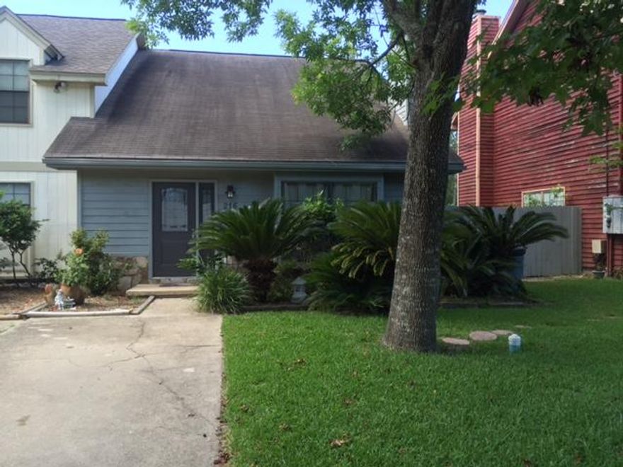 This is a lovely and sizeable townhome. Stone Fireplace in Living room w/mantel. Also a large box window. New front entry door w/sidelite. Designer wallpaper in Kitchen/Dining room area, Nice cabinets, Glass sliding door in kitchen, overlooks the lily-pad pond. Chain link fence on property in back yard, goes almost to the water. Brick type patio. Glass sliding door in Master Bedroom that overlooks the pond & patio. Glass sliding door are AS IS.