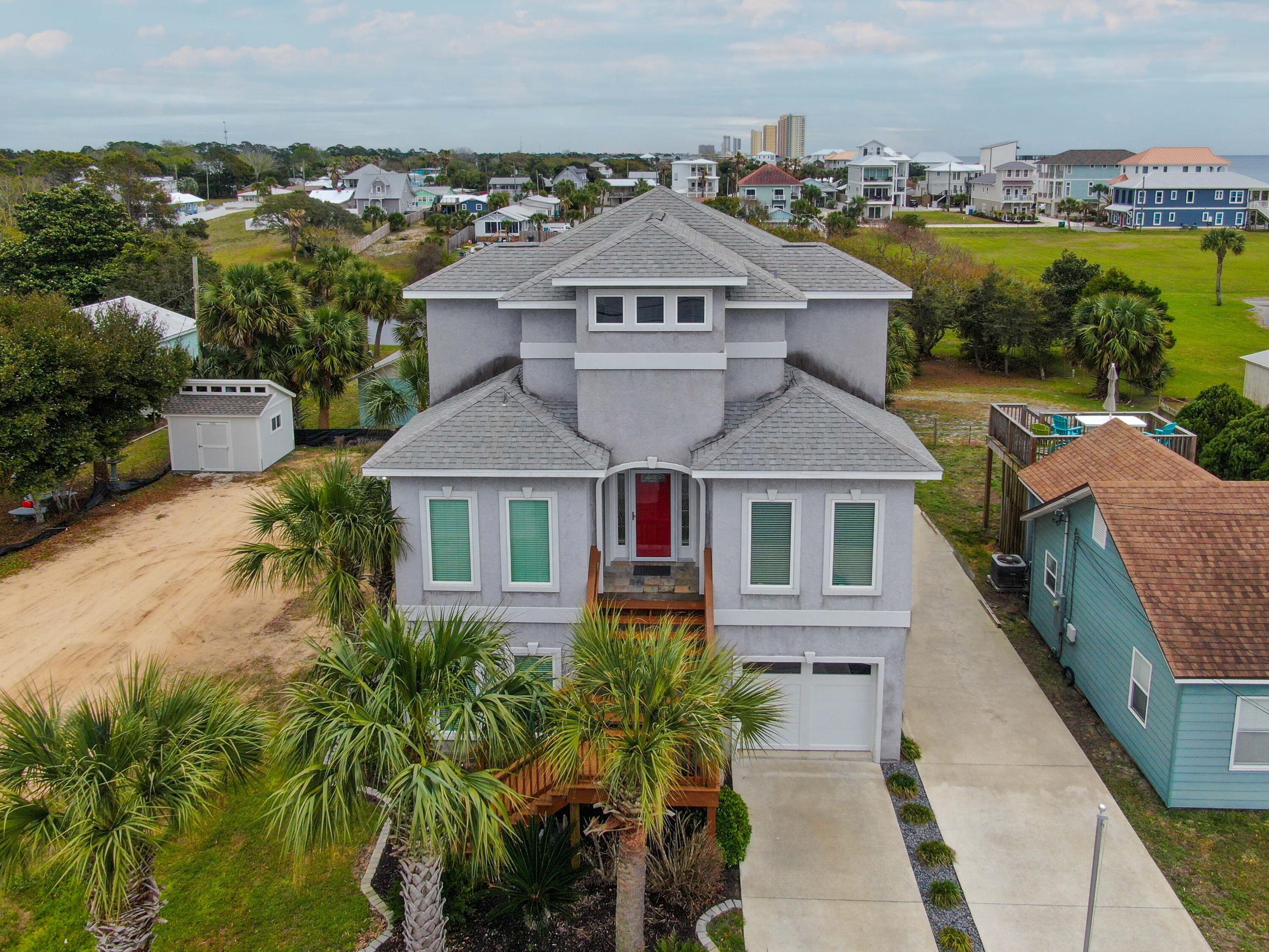 Amazing custom built Beach home just 500 yards from the Gulf sands. This home is built with 2x6 construction, There is a view of the Gulf from every floor of this home. As you enter through the front door, you come thru the oversized foyer into the main section of the house that offers the most stunning view of the Gulf, The kitchen has custom cabinets, granite counter tops, the flooring is a beautiful White oak real wood flooring. The home has an elevator to make it easier for those who can not navigate the stairs. there is a bedroom and laundry room on the main floor. The upstairs is the master Suite with a wrap around porch, spa style master bathroom with walk in closets and tile shower, and the down stairs lowest level has an extra living space, with closet, its own balcony, and a work