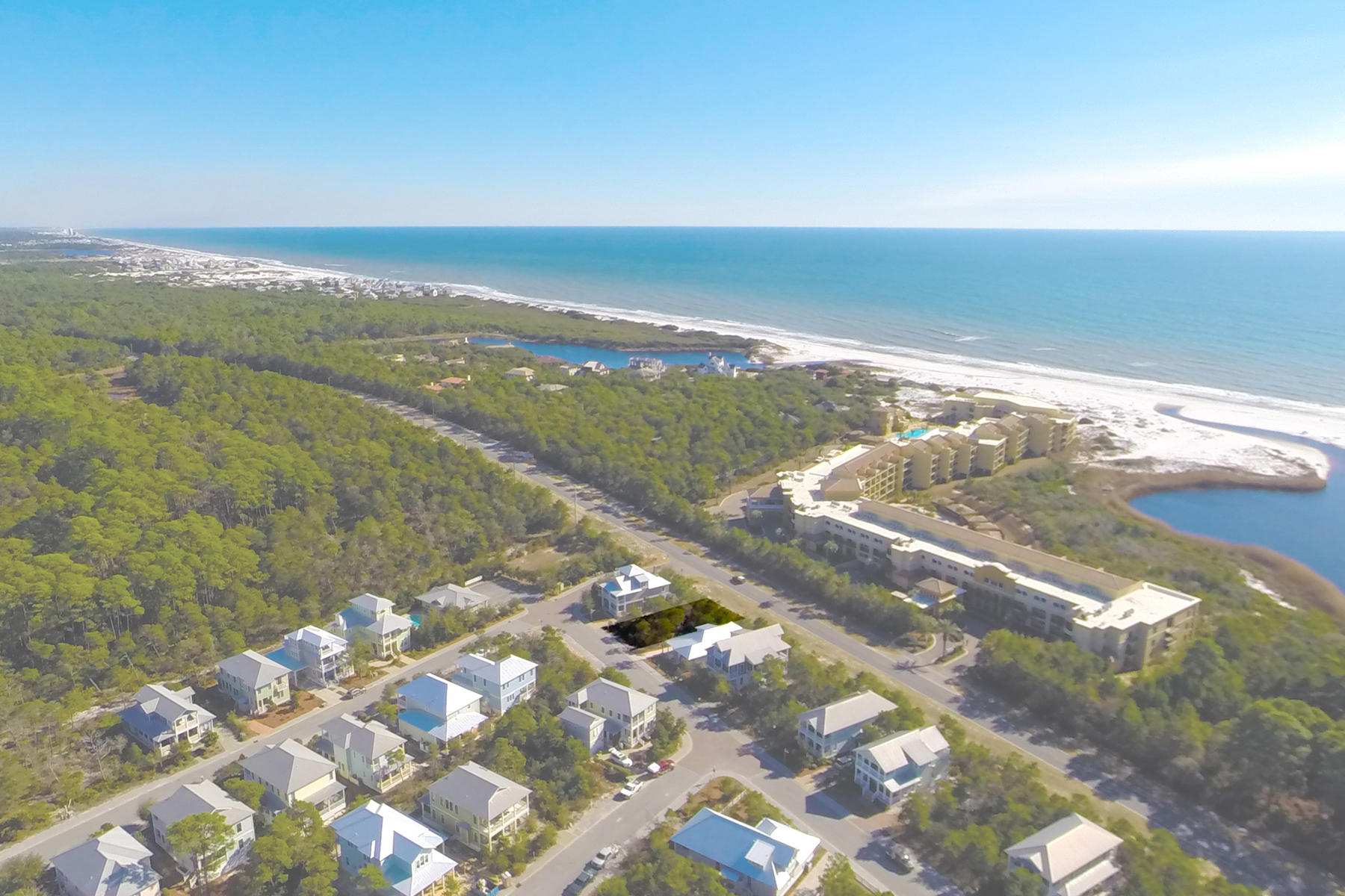 Offering prominent visibility from Scenic Highway 30A, this lot within the gated confines of The Preserve at Grayton Beach is fewer than 50 feet from one of two community pools, and just less than 150 yards from deeded beach access. This intimate neighborhood is ensconced by Point Washington State Forest, enhancing its privacy and exclusivity. Owners enjoy access to two pools, one of which is heated seasonally, a club house, fitness room, and tennis courts. Shopping, dining, and seasonal entertainment in Seaside is just over 3 miles to the east. Bike there by way of a paved pedestrian path which runs alongside 30A for 18 miles through unique beach communities, and past rare coastal dune lakes. Construction should begin by March 2018, with a certificate of occupancy issued by March 2020.