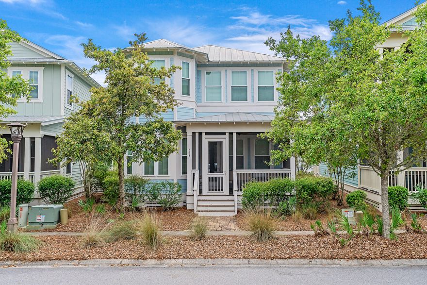 Welcome to 838 Sandgrass Boulevard, a stunning 3 bedroom, 4.5 bathroom home located in the highly sought-after NatureWalk at Seagrove community. Well placed in the community, this home boasts a prime location just across the street from the Gathering Place, the community's amenity center and playground.This beautiful home is just steps away from the trail that leads directly to the beach, providing easy access to the crystal clear waters and sugar white sand that the Gulf of Mexico is known for. Plus, with a golf cart barn included, you'll have room for your golf cart- a fun and convenient way to explore the area and enjoy everything it has to offer.  This home is being offered fully furnished & boasts rental projections as high as $90,000!