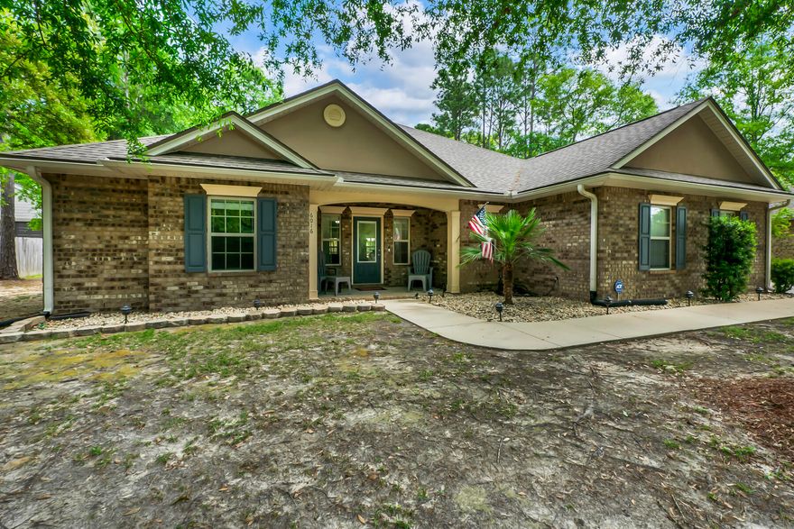 Welcome to your new home in Camellia Cove! This charming all-brick residence offers the perfect blend of comfort and space. Situated on a generous half-acre, with covered front and back porches and a large, privacy-fenced back yard, you'll have plenty of room to bring your creative visions to life -- enjoy the luxury of space and privacy in this peaceful setting.Inside, you'll find a spacious single-story layout featuring a large open great room, perfect for gatherings and relaxation, complete with built-in bookshelves. The roomy, eat-in kitchen is a chef's delight and features granite countertops, plenty of counter space, stainless appliances (including a flat cooktop stove), and a pantry. The split bedrooms offer privacy and tranquility,. The primary bedroom has its own en suite