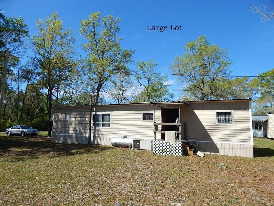 2 bed 1 bath mobile home on a large lot.