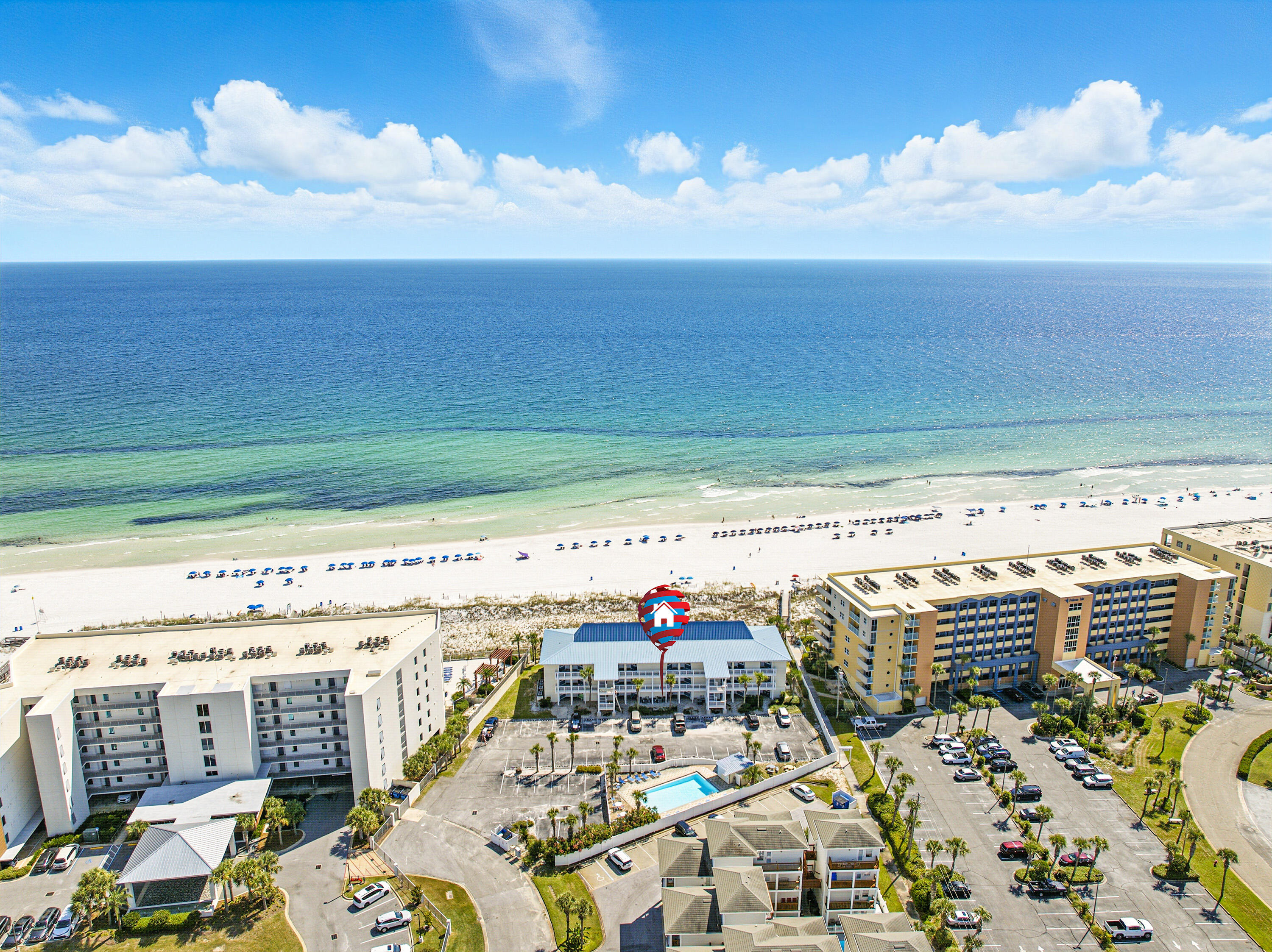 Enjoy the luxury of beachfront living in this ground floor condo located in a charming 27 unit community on Okaloosa Island. Step out from your private patio to direct beach access and sink your toes in the sand within moments. This condo offers the ultimate convenience, with no stairs or elevators, just effortless access to the beach, pool, and community amenities. With rental projections of $47K annually, it's an excellent opportunity as a primary residence, vacation escape, or investment property. Community features include a sparkling pool, grilling and picnic area, assigned parking with guest spaces, and well maintained grounds. Just minutes to local dining, shopping, and attractions, this condo offers the perfect blend of coastal lifestyle and investment potential.