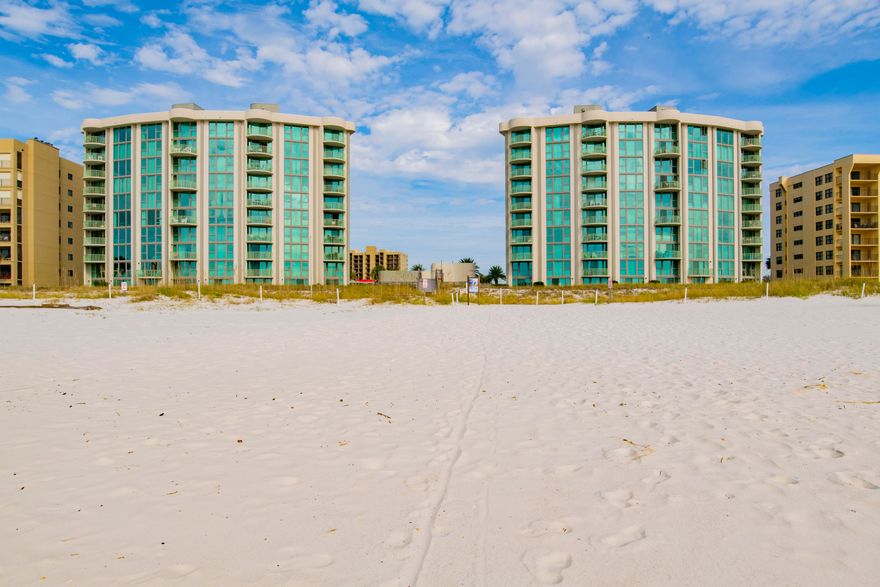 Make EVERY DAY a BEACH DAY at Perdido Towers #502  Here in this BEAUTIFUL 2-bedroom/2.5bath BEACHFRONT 2-STORY RESIDENCE, you can RELAX and ENJOY spectacular GULF VIEWS from the living room, master bedroom and oversized guest bedroom with Views of Old River.. There are even MARVELOUS views of the Old River from the kitchen. A VIEW FROM EVERY ROOM IS RARE! The large amount of SQUARE FOOTAGE is ALSO RARE and provides PLENTY OF SPACE for EVERYONE in the family to LOUNGE after a SUN-FILLED day at the BEACH and POOL! Make yourself at HOME in an open, FULLY EQUIPPED, stainless steel kitchen and INDULGE yourself with fresh, local dinners at your large dining table - there is enough ROOM TO HOST everyone you LOVE! The condo provides it's OWN in-unit LAUNDRY on the first floor, so you can toss