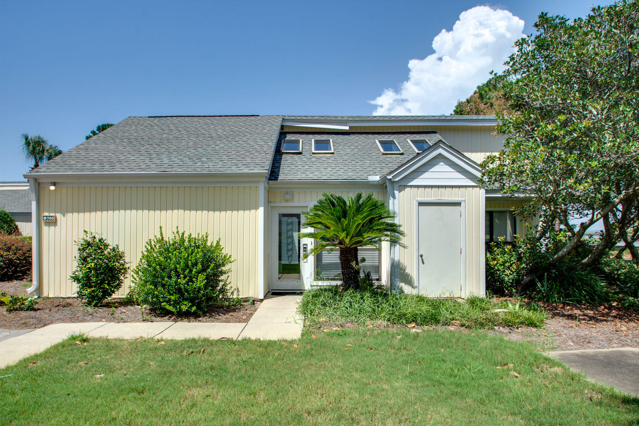 Located in the quaint community of Sandpiper Village, this single story detached condominium home offers the privacy of your own home with all the comforts of care free condo living! The original screened porch has been converted to an extra heated/cooled living space, adding additional square footage not recorded. This home offers tile floors in the main living space and carpeted bedrooms. The front master bedroom has a private ensuite equipped with a walk-in shower and a walk-in closet. Off the living area is a separate screened porch to relax and enjoy the resort lifestyle. Sandpiper Village is conveniently located just a 1/4 mile from the Linkside Conference Center, Sunset Bay Cafe, and Sandestin Fitness Center. Sandpiper owners also enjoy access to the two heated SOA pools: