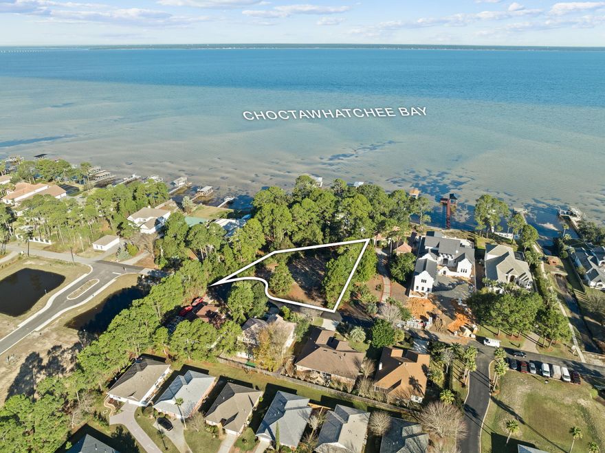 Build your dream home in the highly desirable Bayside community of Miramar Beach. This prime residential vacant lot offers bay views beginning at approximately 25 feet of elevation, creating the perfect setting for a custom coastal retreat. Tap fees are already paid, saving time and upfront expense. Enjoy a short walk to Legion Park and the waterfront, complete with a public boat ramp--ideal for boating, paddleboarding, and sunset strolls. Bayside residents also enjoy exceptional community amenities including bay access with a dock, a community pool, tennis and pickleball courts, a playground, and a pavilion with grilling and picnic areas. Located just minutes from the beaches of the Emerald Coast, dining, shopping, and entertainment.
