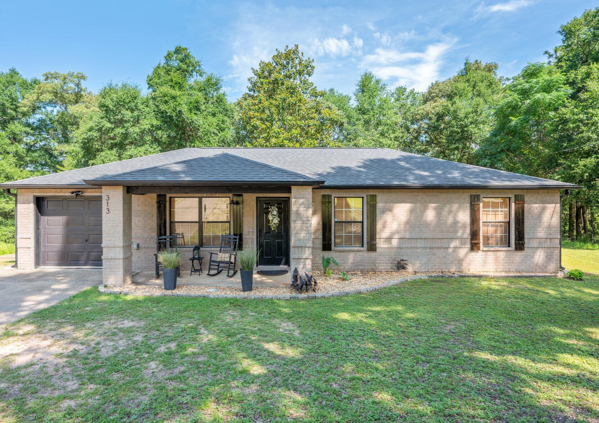 Don't miss this move-in ready gem ! This 3 bedroom , 2 bathroom home sits on a spacious .47 -acre lot and even includes a custom treehouse-perfect for outdoor fun. Inside, enjoy stylish LVP flooring throughout, warm butcher block countertops, shiplap accents in the bathrooms, and custom floating shelves. The living room features a beautiful wood beam, and the kitchen boasts a custom vent hood. Thoughtful updates include modern fixtures, vanities, tile flooring, mirrors , and faucets. Major systems to include a New Roof 2021, NEW dishwasher 2025 and HVAC updated in 2017. Located in N Crestview with easy access to local bases, shopping, and Florida's stunning beaches. Call today to schedule your tour or bring your favorite realtor!