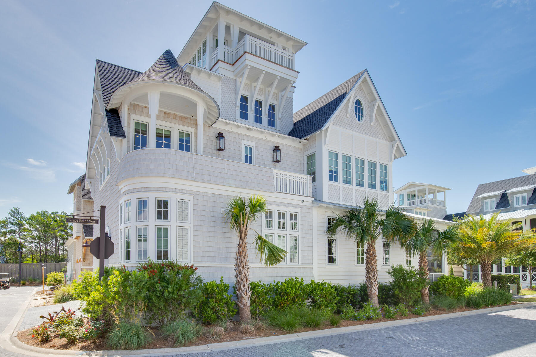 Designed by well-known architect Rick Lowe, this fully-furnished 4 bedroom, 5-1/2 bath home offers grand living in the magnificent setting of Grace Point on 30A. Boasting a balanced blend of coastal chic, wood tones, the layout, and flow of the home is both welcoming and timeless for friends and family to enjoy. Upon entry to the residence, the overhead hand-hewn beams will captivate your attention, as you step onto the warm hardwood flooring, your eye is drawn to the shiplap walls, custom built dining table and cozy sectional that is covered with natural sunlight.