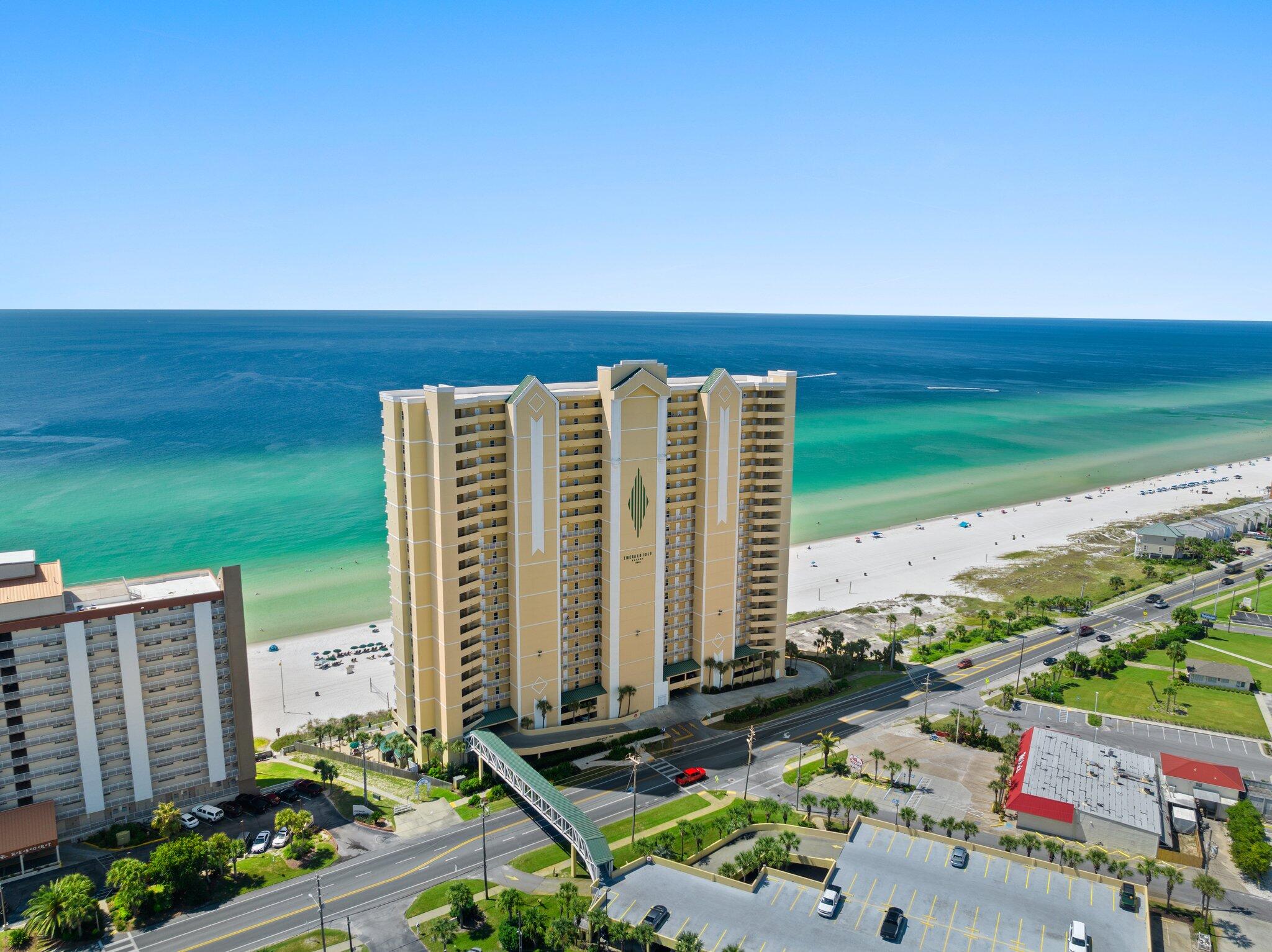 Welcome to Emerald Isle Unit 1507, a stunning 2-bedroom, 2-bathroom Gulf-front condo that perfectly blends modern upgrades with coastal charm. Nestled on the desirable west end of Panama City Beach, this exquisite retreat offers breathtaking views, upscale renovations, and a prime location just minutes from Pier Park, shopping, dining, and endless entertainment options. Step inside to discover a fully renovated kitchen designed for both style and functionality. This chef's dream boasts soft-close cabinets and drawers, elegant 42-inch-high upper cabinets, and two corner lazy-susan storage areas with individual LED lighting. The new granite countertops and stylish backsplash complement updated appliances, while extra outlets on the peninsula provide added convenience. Under-counter LED lighting and a dimmable ceiling fixture create the perfect ambiance for any occasion. Additionally, the cabinetry above the fridge includes pullout shelves for easy access, and the heavy-duty, extra-quiet garbage disposal ensures a seamless cooking experience. The open-concept living and dining area is adorned with all-new lighting and coastal-style ceiling fans, enhancing the airy and inviting atmosphere. Relax in the newly furnished living room, featuring a plush sofa sleeper and loveseat, ideal for entertaining or unwinding after a sun-soaked day on the beach. Floor-to-ceiling sliding glass doors lead to an expansive Gulf-front balcony, where an added electrical outlet makes it easy to enjoy your morning coffee while watching the sunrise or an evening cocktail as the sun sets over the horizon. Both bedrooms provide a tranquil retreat with ample space and comfort. The master suite boasts direct balcony access, allowing you to wake up to the soothing sounds of the ocean. The ensuite bathroom is well-appointed, ensuring privacy and convenience. The guest bedroom and additional bathroom offer comfortable accommodations for family and friends. For ultimate convenience, this unit includes an outdoor storage closet, perfect for beach chairs and gear, as well as a designated parking space on the 3rd-floor parking garage. Additionally, ample parking is available across the street on the additional parking deck. Emerald Isle is a premier Gulf-front resort with an impressive array of amenities, including multiple pools, a relaxing hot tub, a fitness center, and direct beach access. Whether you're searching for a lucrative vacation rental opportunity or a private coastal getaway, Unit 1507 is a rare gem that offers both luxury and location in one breathtaking package. Don't miss the chance to own a piece of paradiseschedule your private tour of Emerald Isle Unit 1507 today!