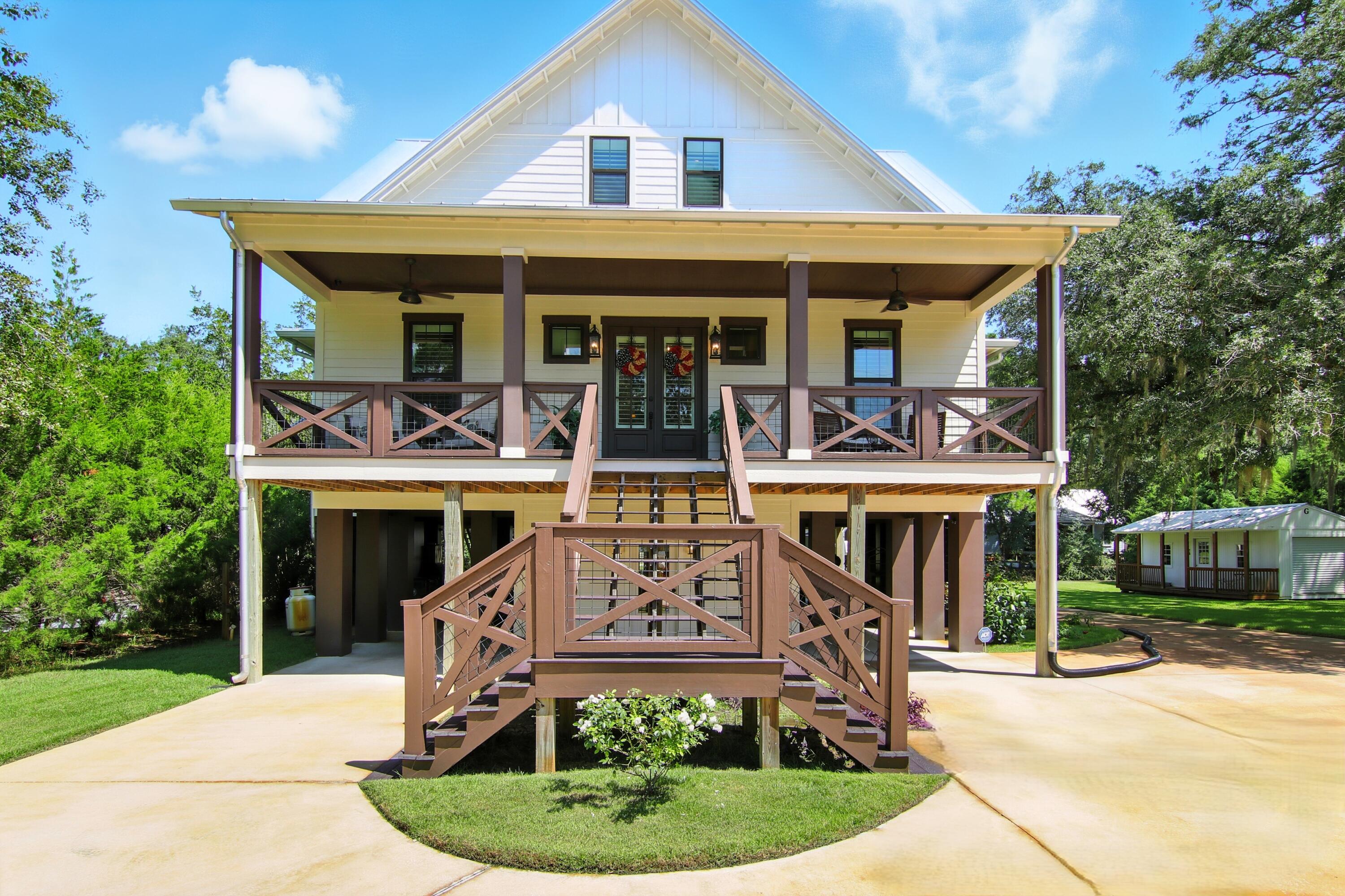 UNIQUE WATERFRONT HOME! Traditional southern-style home located in a quiet neighborhood with the ''old Florida'' feel. With 130 feet of protected canal frontage, it is an easy boat ride to Choctawhatchee Bay. You can relax on the front porch while viewing the bay or settle in on the back screened porch overlooking the yard and canal. This home boasts three stories with an elevator for your convenience. The well-appointed kitchen meets the needs of any chef, with a butler's pantry and plenty of counter space! The open floor plan allows for easy entertaining across the main living areas. The primary bedroom is oversized with abundant natural light and French doors to the porch, as well as roomy custom closets and an enormous walk-in shower with dual shower heads. This is a MUST SEE!!!!