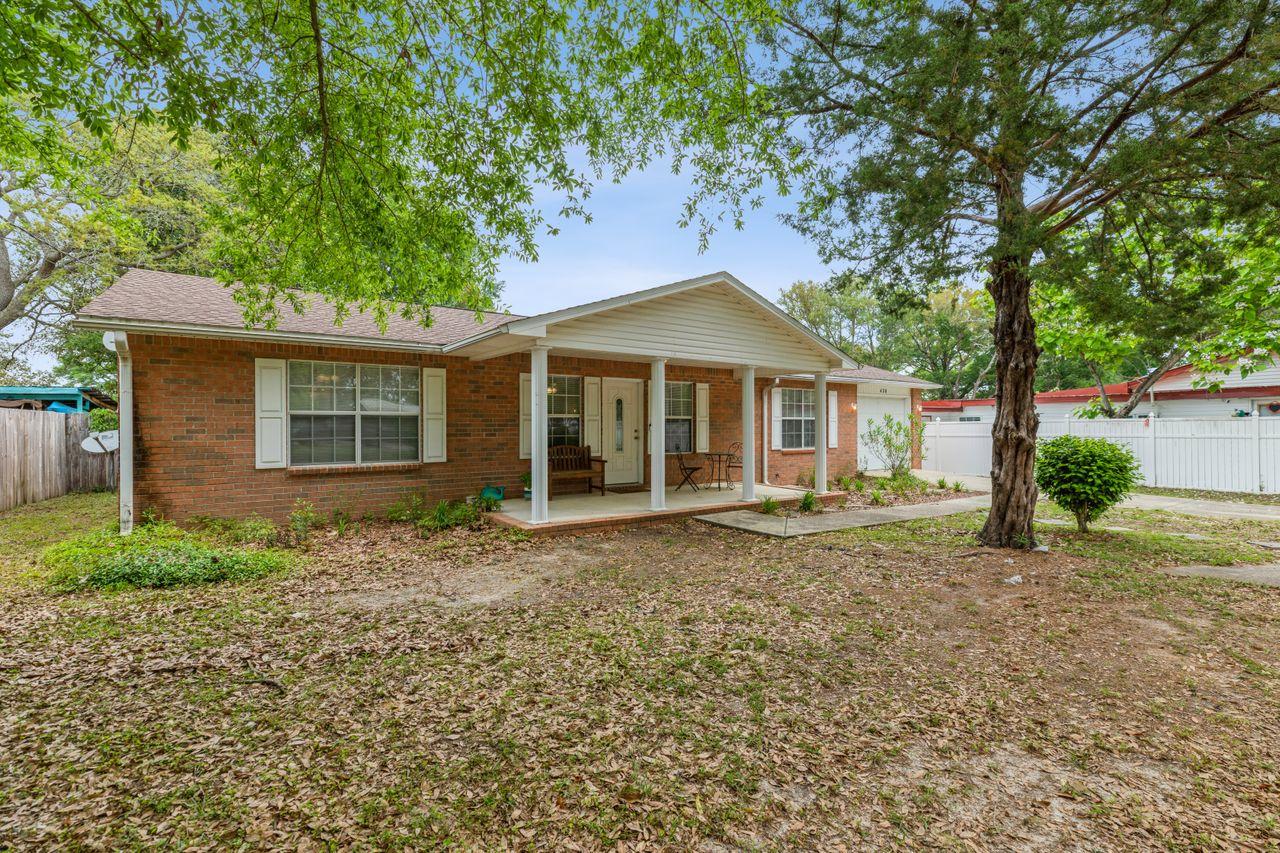 MULTI-OFFERS - Seller calling for Highest and Best by 10 AM on Monday, 5/10/21. Relax on your covered front porch or cozy up next to your wood-burning fireplace or BBQ in your spacious backyard! This Home Sweet Home comes with a desirable split floor plan featuring an open living-dining room space. So many upgrades have been made! Complete renovation prior to the current owners moving in including a New Roof and new exterior doors, new lighting, GFCIs, etc. You'll love the Gorgeous newer flooring, neutral paint, and white cabinetry that provide an overall clean feel to this space throughout the home. The luxurious walk-in shower was added to the home when the homeowner updated the master bath, also adding a barn door to save space in the master bedroom.
You'll enjoy the convenience of this location just minutes away from Eglin AF Bases, North West Florida State Collage Boggy Bayou & Toms Bayou. Washer and dryer that convey to the new buyers at closing. Call today for your private tour. Come see this amazing home before it's gone!!