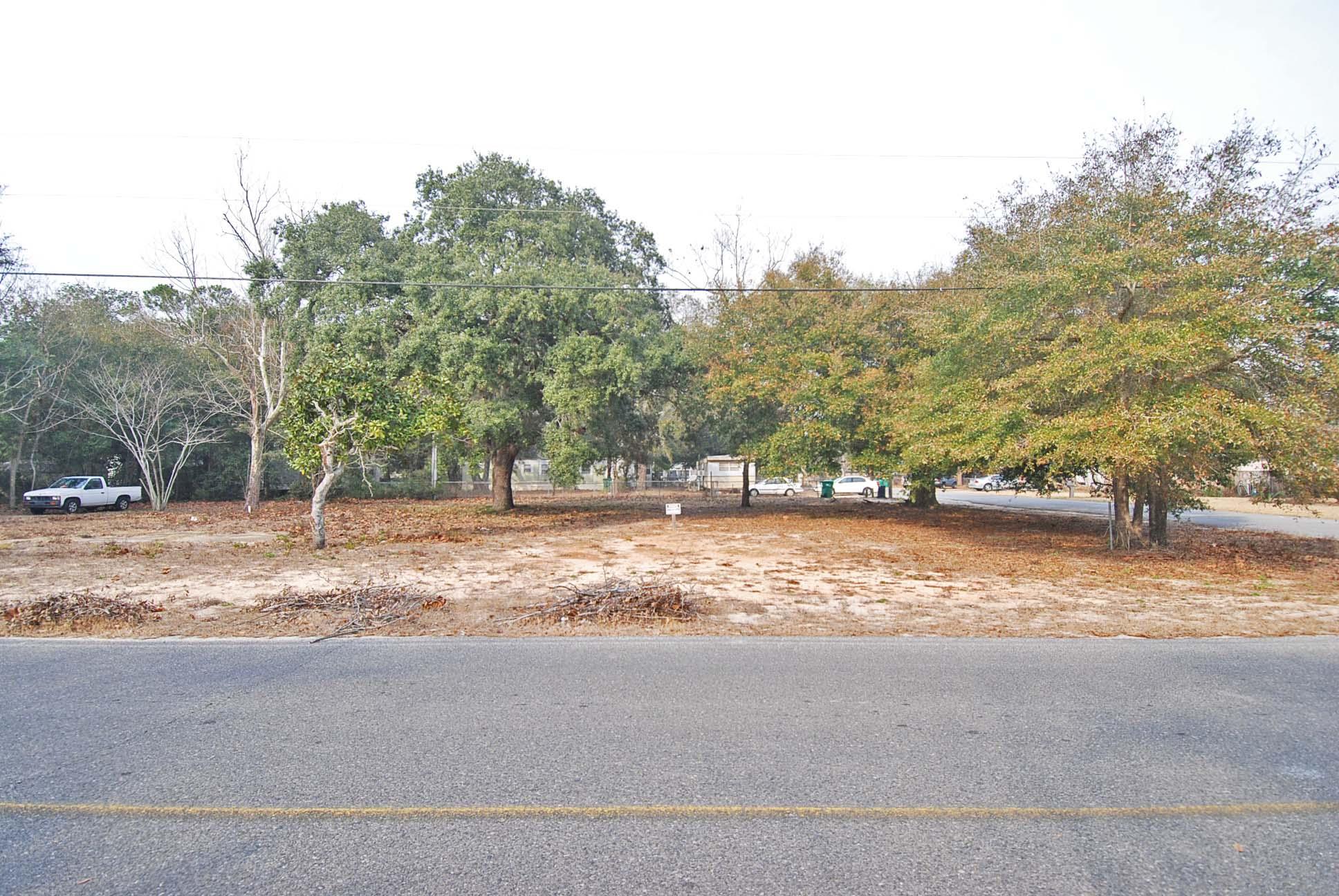 A COMFORTABLE FIT FOR ANY BUDGET! Huge corner lot in the heart of Fort Walton Beach. Close to shopping, dining, schools, both military bases and the hospital. Easy to clear and no HOA.