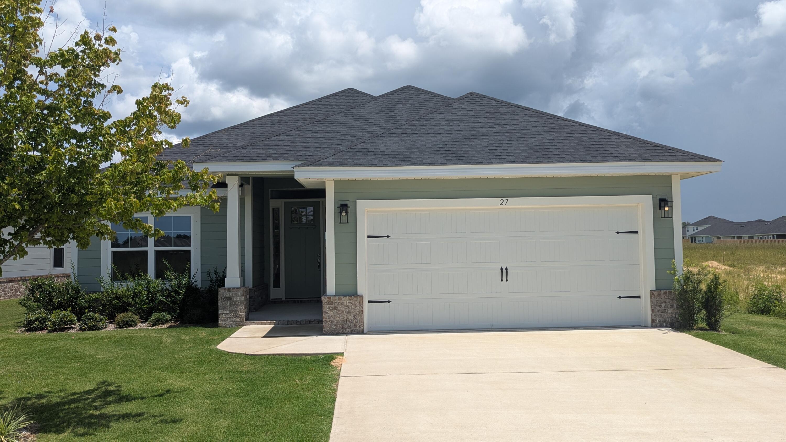 Limited time offer: 4.99% fixed rate financing (FHA/VA) + up to $10K flex money + builder pays most closing costs with a preferred lender.Just a 20 minute drive to South Walton beaches or a 15 minute drive N to DeFuniak shopping. Craftsman 4 BR/2 BA home with Hardiboard siding and brick skirt. LVP flooring throughout. Cathedral ceiling in main living area, all ceiling heights are 9' or higher. 8' entry doors, quartz countertops. Master Bedroom has a large walk-in closet. Master Bath has garden tub + separate shower, undermount sinks and dual vanities.