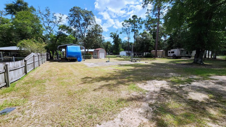 Whether you're looking for a relaxing getaway spot or a beautiful new homesite, come take a look at this lot on Trout Circle. Only a half mile to Black Creek boat ramp, 5 minutes to the awesome Choctawhatchee Bay, and 20 minutes to the gorgeous 30A beaches on Florida's Emerald Coast! Included with the property is an existing camper under a carport PLUS a large shed with washer/dryer hookups and electricity. There's a fenced area for your pups as well. The camper needs bedroom area repair but the living area is in great condition. If you're not as interested in the camper but desire a more permanent home lot, this property could be the perfect fit. Lot listings like this are rare: already cleared, connected to public water, septic, electric, no HOA, flood zone X, AND you have the option of a mobile home. Schedule your showing today! 
Note: buyer is to confirm suitability for intended use. Information in the listing is deemed to be accurate but not guaranteed.