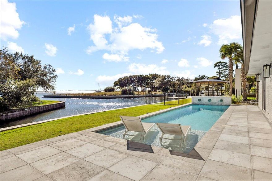 Price Improvement - Don't miss out! Renovated waterfront home in the highly sought-after Soundside community of Gulf Breeze. Perfectly situated at the mouth of the canal with STUNNING views of the Santa Rosa Sound, this beautifully redesigned home blends modern elegance with timeless coastal charm. The expanded floor plan offers an additional bedroom and full bath, a completely new kitchen, fresh paint, stylish finishes, and open, light-filled living spaces that showcase the serene water views. Outdoors you'll find a new heated in-ground pool, covered patio, fenced backyard, new concrete driveway, raised vinyl seawall, lush Zoysia sod, and updated landscaping. 134 feet of water frontage. Experience the very best of coastal livingluxury, lifestyle, and location all in one.  Want a boat dock?  No problem - There is room to have one installed to meet your needs! 