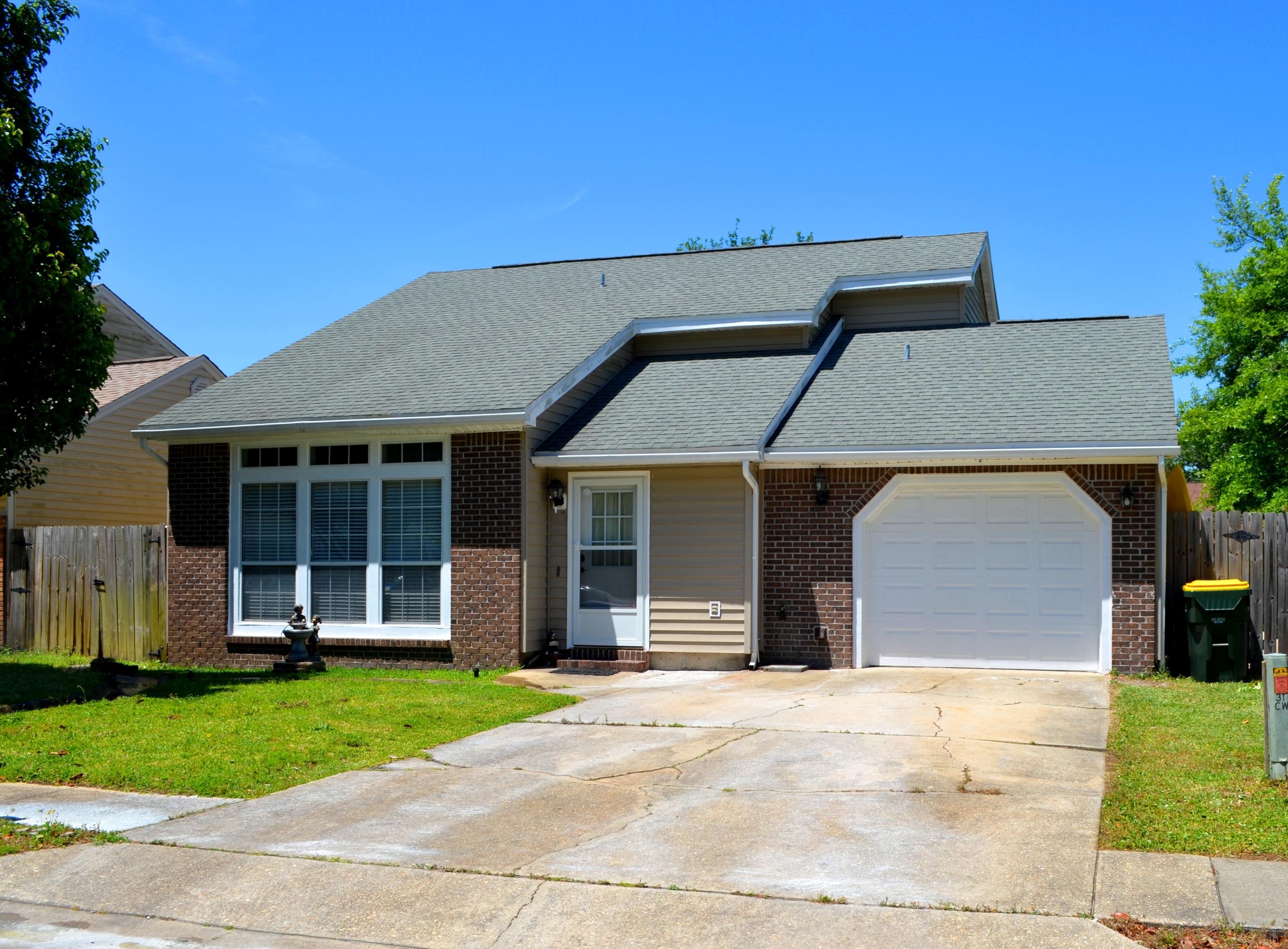 Two-story home with a split floor plan AND one car garage. Master bedroom is downstairs and spare bedrooms are upstairs with a second full bath. Wood floors throughout, aside from the stairs, which are carpeted. The living room features floor to ceiling windows for lots of natural light. The kitchen has stainless steel appliances, to include a gas stove. The backyard is completely fenced in. Walking distance to elementary, middle, and high schools. Seconds from HWY 98. Call today to schedule a viewing! Sorry, pets are not negotiable.