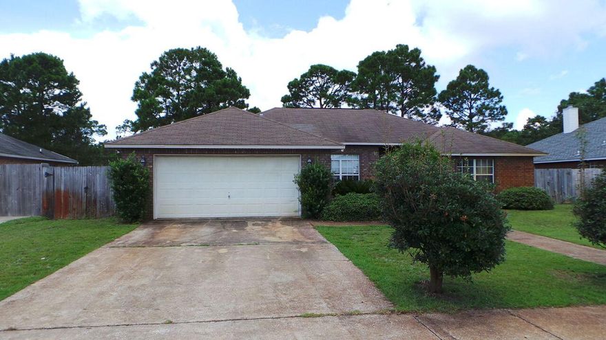 Lovely home available now in desirable Gulf Breeze. Home is large, at over 2k square feet and features four bedrooms, two bathrooms, large eat-in kitchen, living area with fireplace and vaulted ceilings. Other charming features include chair rails, baseboards, crown molding, more than one walk in closet, and the list goes on. Tile for easy cleaning in kitchen and bathrooms. Master bedroom has expansive trey ceiling with wide beveled crown molding ledges and also has its own bathroom which boasts double vanity and walk in closet. Home also offers amenities like pull down stairs, two car garage, separate laundry area and is conveniently located to main roads, Gulf Breeze Zoo, beaches and more. Call today before this one passes you by!
