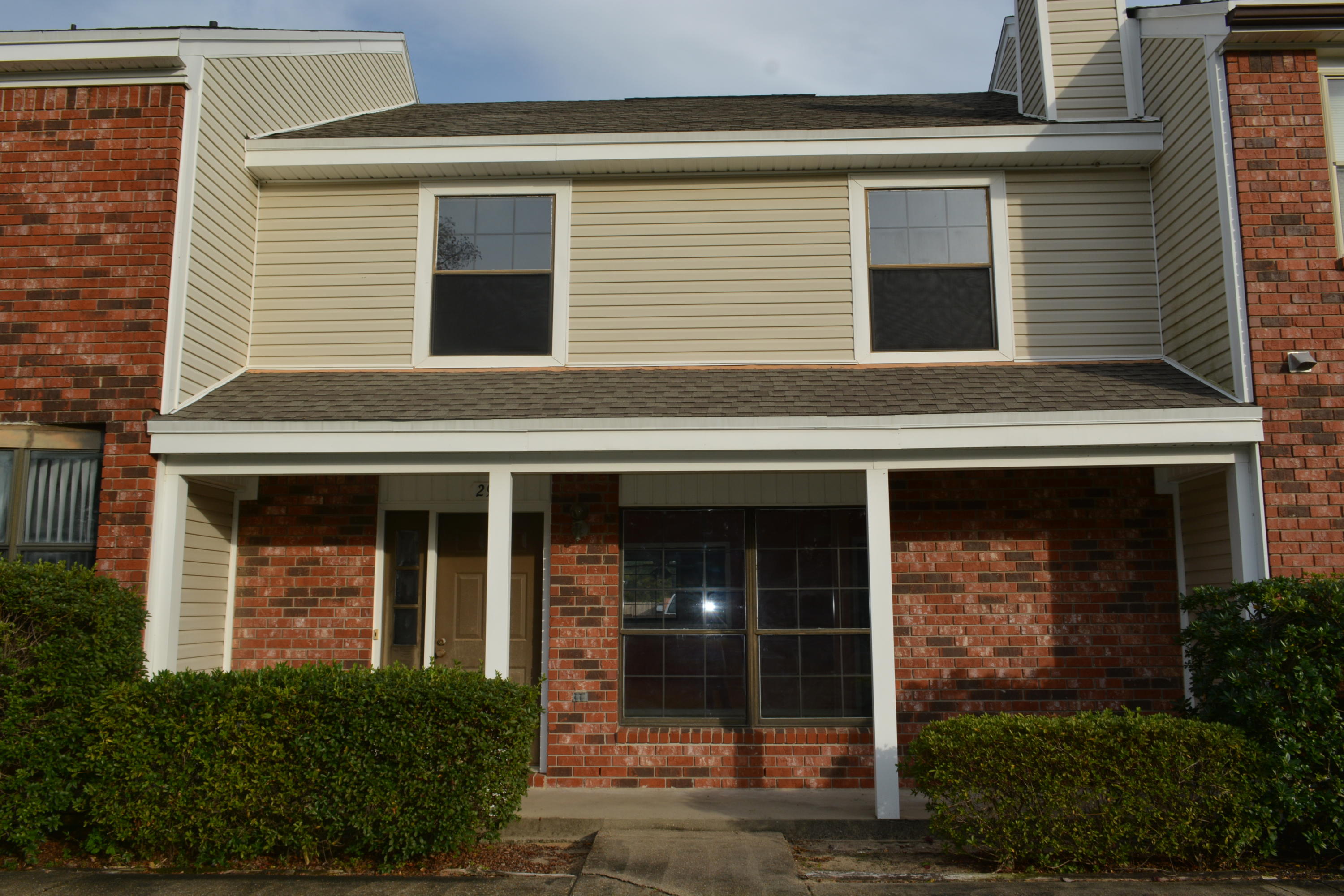 REO. Adorable townhome in Shalimar close to Eglin, schools and shopping. Portofino is one of the nicest townhome communities in the area. This has all the features; a front porch overlooking the courtyard and pool, a fireplace, one car garage, and an inside laundry. Completely repainted inside with new vinyl flooring in the kitchen and new carpeting in the living room and bedrooms make this move-in ready. There is a powder room on the first floor. The second floor has two huge bedrooms, a hollywood bath, and lots of closet space. Don't miss seeing this lovely townhome today!