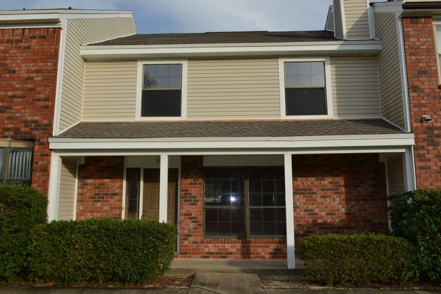 REO. Adorable townhome in Shalimar close to Eglin, schools and shopping. Portofino is one of the nicest townhome communities in the area. This has all the features; a front porch overlooking the courtyard and pool, a fireplace, one car garage, and an inside laundry. Completely repainted inside with new vinyl flooring in the kitchen and new carpeting in the living room and bedrooms make this move-in ready. There is a powder room on the first floor. The second floor has two huge bedrooms, a hollywood bath, and lots of closet space. Don't miss seeing this lovely townhome today!