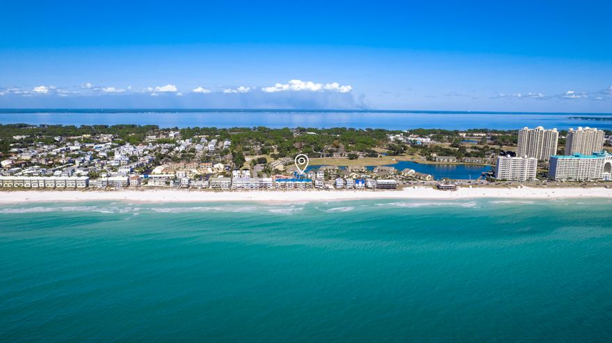 Step into your perfect beachside escape, where the heart of comfort and style begins in the spacious living room of this charming one-bedroom condo. Ideal for couples or small families seeking a slice of seaside bliss, this cozy retreat is just steps away from the sandy shores.As you step inside, the thoughtfully furnished living room takes center stage, inviting you to relax in front of the large flat-screen TV or sink into the plush seating. It's the perfect space to unwind and plan your beach adventures.From here, a hallway leads to a unique feature of this condo: a light and bright one-and-a-half bathroom layout, designed with three separate areas.