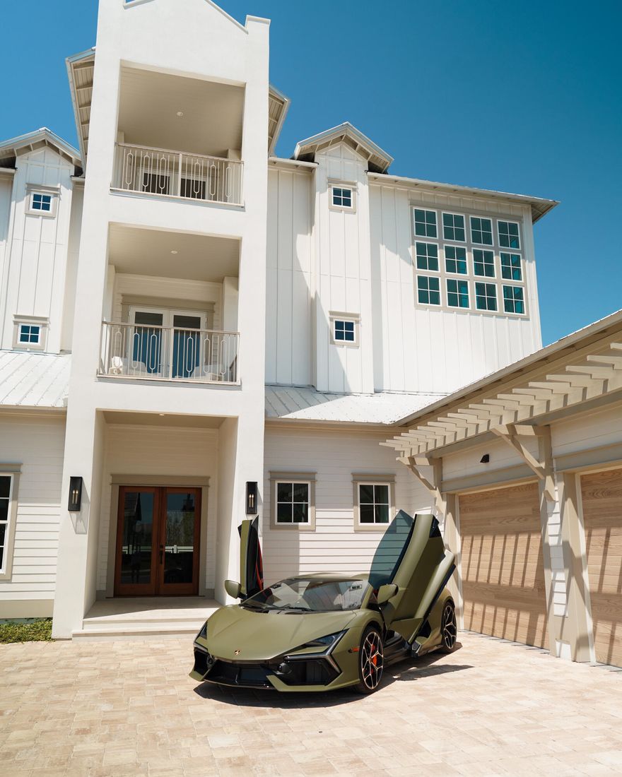 Discover an exquisite architectural masterpiece designed by the renowned John Williams, currently under construction and discreetly nestled behind the private gates of Camp Creek. This luxurious residence embodies impeccable craftsmanship with a tasteful coastal influence throughout and is offered for sale at $5.295 million.Culinary enthusiasts will delight in the dream kitchen, featuring custom milled cabinetry, a generously sized island, Brazilian Natural Stone countertops, and a top-tier appliance package, including a gas range. The expansive living and dining areas seamlessly connect to the kitchen, offering direct access to a covered porch with an outdoor kitchen, blurring the boundaries between indoor and outdoor spaces and creating a true extension for living and entertaining.
Strategically situated on the first level, the primary suite overlooks the pool and boasts a spa-like ensuite with dual vanities and a beautifully tiled wet room. An additional bedroom with its own private ensuite completes the first floor. The second and third levels host spacious bedrooms, each with ensuites and private covered balconies, providing the perfect vantage point to savor the mesmerizing hues of the famed Emerald Coast sunsets.
As part of this exceptional offering, the sale of 450 Windsong Drive includes a luxurious 2024 Lamborghini Revuelto V12 Hybrid, finished in a rare Flat Military Green. This exclusive vehicle adds a unique dimension to the lifestyle experience associated with this stunning property.
450 Windsong Drive also includes a WaterSound Club Membership, granting access to the exclusive private beach club and some of the area's finest golf courses, such as Camp Creek, Sharks Tooth, Origins, and the planned Davis Love course. This rental-restricted community features a newly constructed amenity center with dual pools, a lazy river, pickleball courts, tennis courts, a wellness center, and an on-site restaurant.
Ideally located between Scenic Highway 30A and Highway 98, the WaterSound Camp Creek community offers convenient access to the iconic town centers of Alys and Rosemary Beach, as well as a wide array of world-class dining and entertainment options along 30A.
Just across Highway 98, the WaterSound Town Center hosts events like a weekly Farmer's Market and provides a variety of amenities, including a Publix, restaurants, a STEAM school learning campus, and medical offices.
Discover today why WaterSound Camp Creek stands as one of the most coveted ownership opportunities along 30A, appealing to both full-time residents and those seeking a second home in this remarkable coastal community.