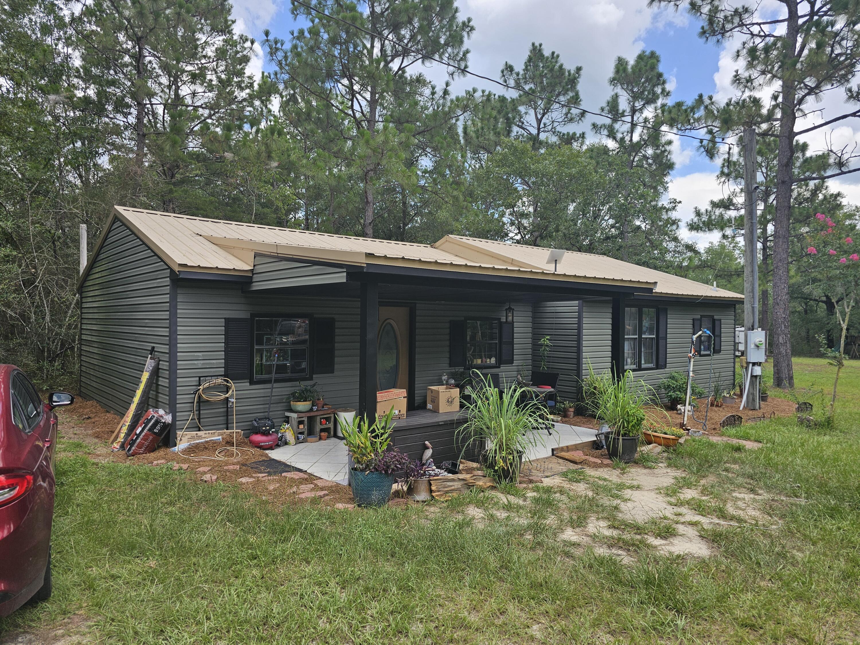 Your homestead opportunity! Private setting surrounded by trees with plenty of room to expand. The 2 bedroom home has an open floor plan, boast a large living area, large dining room and spacious Kitchen with plenty of counter space and separate laundry room. There is also a well in place so you can save on water. Great opportunity for that private get-away or to build your dream home
