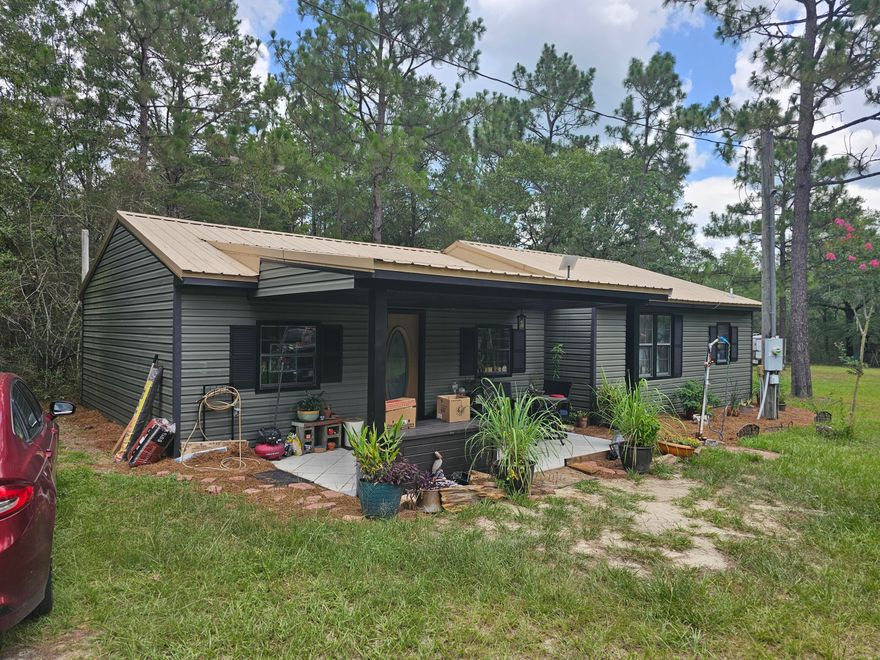 Your homestead opportunity!  Private setting surrounded by trees with plenty of room to expand.  The 2 bedroom home has an open floor plan, boast a large living area, large dining room and spacious Kitchen with plenty of counter space and separate laundry room. There is also a well in place so you can save on water. Great opportunity for that private get-away or to build your dream home
