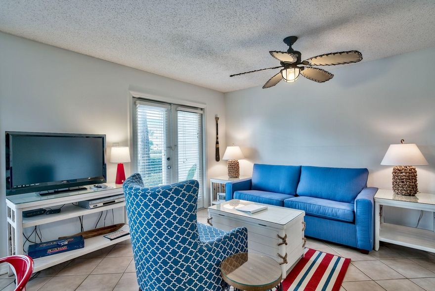 Walk into this unit and say stress be gone! Grand Caribbean unit 101 is a spacious 2 bedroom, 2 bathroom with built in bunks in the hall. The 2nd bedroom is large enough that it has two queen beds. This unit is an end unit which means extra windows to let the Florida Sunshine in.   Tile floors, updated kitchen, baths, fully furnished & rental ready. Make this your second home, or enjoy the $40,000.00 a year proven rental revenue. build some equity. Grand Caribbean East is a wonderful condominium community in the quiet, friendly neighborhood of Crystal Beach. With a saltwater pool all steps from your door.  The streets are lined with sidewalks, so it's very easy to get around this quaint neighborhood. You can walk to many restaurants including Camille's, The Crab Trap, Capt. Dave's, 790 .