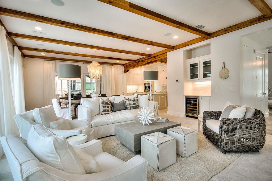This custom designed residence is just steps from the beach. TS Adams Architects & Gulfview Construction collaborated on a true masterpiece. Upon entering one appreciates the extraordinary use of skillful millwork & craftsmanship evident in the custom trim, doors & cabinetry. There is an abundance of natural light streaming through the plethora of windows. The windows allow for a dramatic vantage point through the house to the exterior spaces. The private outside retreat is complete with heated pool & plenty of deck space for entertaining. There is both a screened sitting porch with fireplace & grilling porch with summer kitchen. All of these upgrades truly set the tone for a gracious, relaxed ambience which is found throughout this one of a kind, unique & inspired beach home. The interiors encompass extraordinary finishes & impressive attention to detail including venetian plaster walls & white oak floors.  The open living room is accentuated by the beamed ceiling & fireplace.  The gourmet kitchen is inviting with all of the highest end accoutrements including Wolf & Subzero appliances & wet bar, no element has been overlooked. Each of the four guest bedrooms  exude a perfect beach vibe with a calming coastal palette & functional designer touches. This theme extends to the en suite baths which are rich in detail & adorned in light shades of marble tile. Take the elevator up to the third floor and enjoy the additional living space which is the perfect spot for the kids.  The master retreat, entices with its size & imaginative use of materials.  The master bath is a true retreat with modern soaking tub & glass enclosed spa shower. The views of the Gulf of Mexico from the tower are spectacular.  Perfectly blending form & function, with a masterful use of timeless lighting, stunning fixtures & pride of craftsmanship this home will leave a lasting impression! 