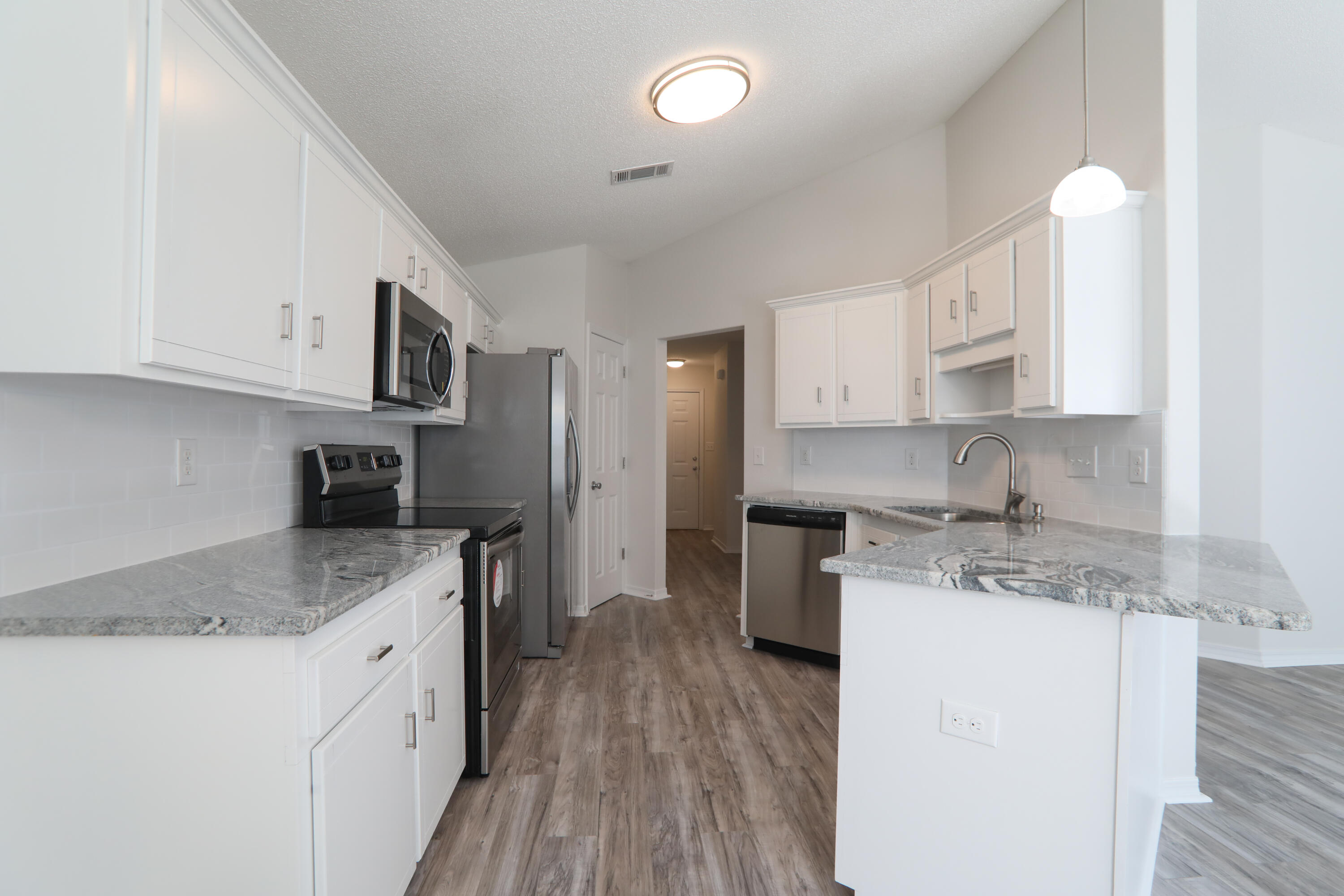 Grab it quick!! 2014 Home totally revamped to new condition. Ready 2014 Ac 2014 Hot water heater 2014 Roof. Updates.Paint cabinets white with new knobs. Granite, Stainless Steel Appliances, Paint inside, new fans and lights, Laminate main areas, vinyl in bathrooms and carpets bedrooms. new door knobs and hinges house, new blinds windows, pressure wash outside of house, shutters front of house. clean yard up landscape front of house.