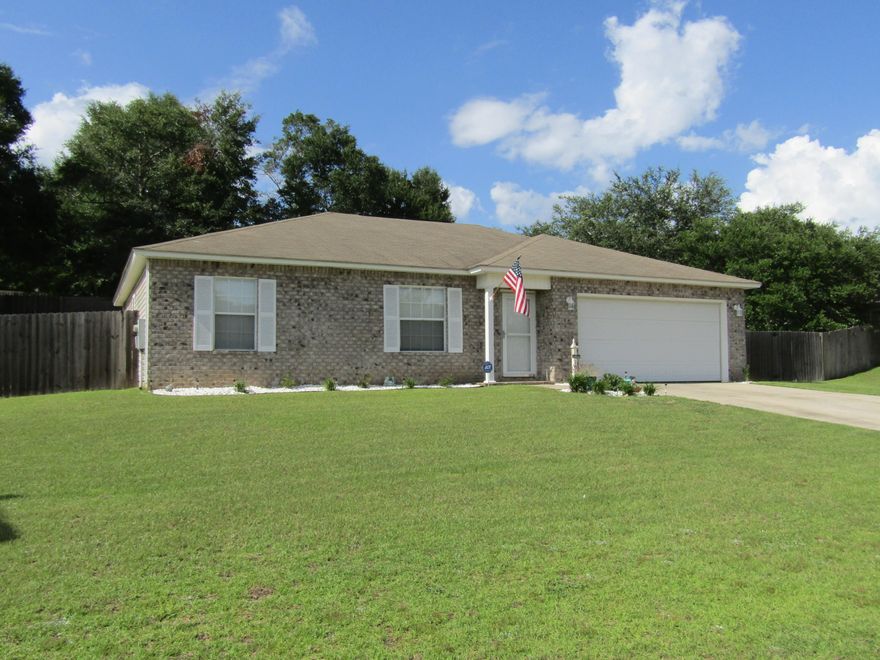 Great 3 bdrm/2 bath home! Great price! Conveniently located! This home is clean, recently painted and move in ready. Roomy kitchen with a breakfast bar overlooking the great room and an eat in kitchen area with a view of the back yard. Recently installed laminate wood look flooring in the great room and master bedroom with tile in the kitchen, both bathrooms and the laundry room. Back yard is completely privacy fenced with room to barbecue/grill on your patio and enjoy the outdoors. Privacy fence has an over sized double gate for backing your boat or other watercraft into the fenced back yard. Quiet neighborhood, well kept lawn and nice landscaping. Home security system installed with every window and door monitored for your peace of mind and security. This home is priced to sell!