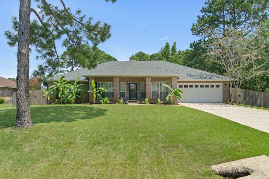 Welcome home to this spacious 4 bedroom, 2.5 bath Holley by the Sea all brick beauty! Have peace of mind with a brand new roof replaced in 2022, a new HVAC in 2022, a new water heater in 2023, AND low energy costs as the sellers will be paying off the solar panels in full at closing! With over 2500sqft on a sprawling 0.46 acre lot there's even room to bring your RV or boat! You'll love the tasteful and well maintained landscaping leading to the covered front patio. Inside appreciate updates like new luxury vinyl plank flooring and new carpet in the bedrooms. To the right is a formal dining room (currently a playroom) which leads to the spacious family room complete with a fireplace, built-ins, and a new sliding glass door. Walk through one of the many archways to find the expansive