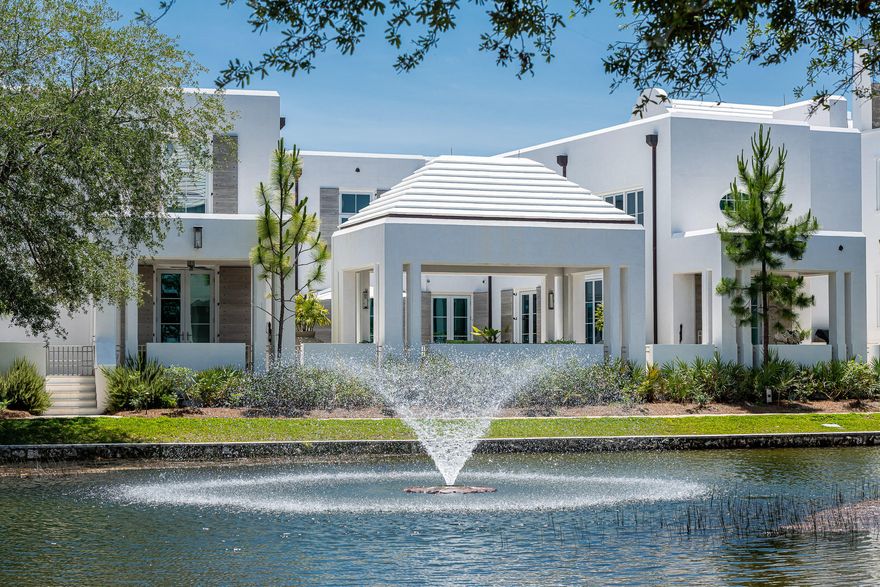 Imagery and words cannot properly speak to the beauty & character 105 Hogpenny Alley provides. Alluring spaces with exquisite craftsmanship encapsulated by the surrounding beauty of Alys Beach's Lake Marilyn center this Bobby McAlpine designed home to perfection. Overlooking the iconic Lake Marilyn of Alys Beach, with 100' of water frontage, this incredible home is only 1 of 8 custom homes designed & built within this prestigious lake front setting.The home's 5,241 square feet of conditioned living space opens to, and surrounds, the manicured courtyard, large covered loggia, and heated pool. The Control 4 remote descends the Sunbrite TV from the ceiling of the courtyard loggia for outdoor movie nights with family & friends. The 5 bedrooms, each having their own ensuite bathrooms