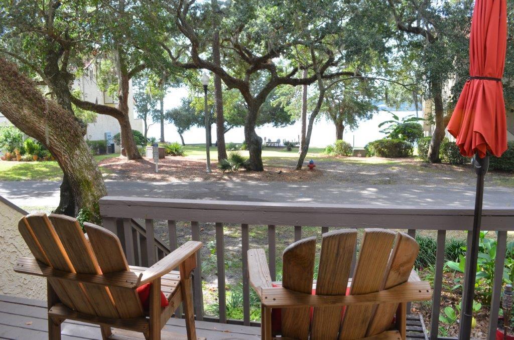 Beautifully Updated - this 2 bedroom, 2.5 bathroom townhome offers enchanting water views from all levels. Relax with your morning coffee from your balcony while you watch the birds at the water's edge. Unwind with your favorite evening beverage at the community dock that sits directly across from your back patio. Beautiful hand-scraped wood laminate flooring. New Light fixtures, kitchen cabinets, back-splash, Silestone counter-tops, Stainless Steel Appliances. Must see bathrooms completely updated. The master bedroom feels spacious with it's vaulted ceiling and expansive view. A unique sliding barn door becons you to your tastefully updated master bathroom complete with dual vessel sinks. Garage space and finished work room complete the ground floor. For practical details click