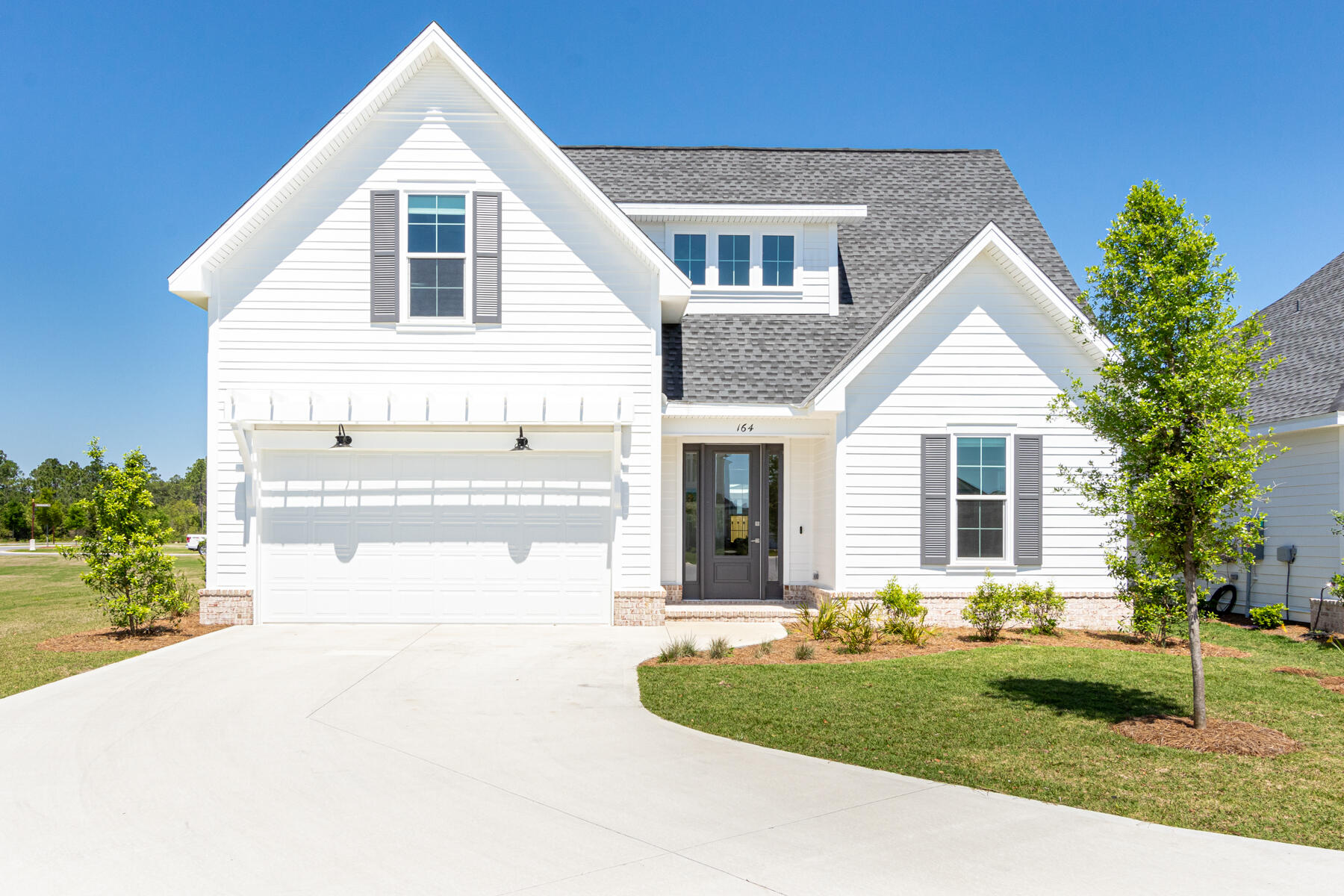 This stunning home located on a corner lot at the end of a cul-de-sac was just completed in the end of January. The 2 story home offers 4 bedrooms, 3 and a half baths, a 2 car garage, gourmet kitchen with stainless steel Bosch Appliances, a large island with Quartz countertops and generous walk-in pantry with custom shelving. Directly off the living area is a spacious screened in porch with brick flooring, fully fenced in back yard and a gas stub for a grill. Located on the first floor, the master bedroom includes a lovely en-suite bathroom and 2 closets. A second living area is located upstairs along with 3 additional bedrooms and 2 full baths...