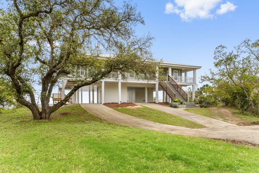 BACK ON MARKET NO FAULT OF SELLER...CUSTOM WATERFRONT 4bed/2.5bath & office.  Wake up to this beautiful ocean view every day! Set well back from the road with a view to remember, relax on the wrap-around porch watching natures finest wildlife. There's plenty of room to entertain guests by the spacious pool, gathered around the kitchen, or in the living room with soaring ceilings.  Walk in and notice the new luxury wide-plank flooring throughout and new high end carpet in the bedrooms. New stainless steel appliances and fresh paint inside and out. This energy efficient home features concrete walls, metal framing for interior walls, and the convenience of a commercial elevator.