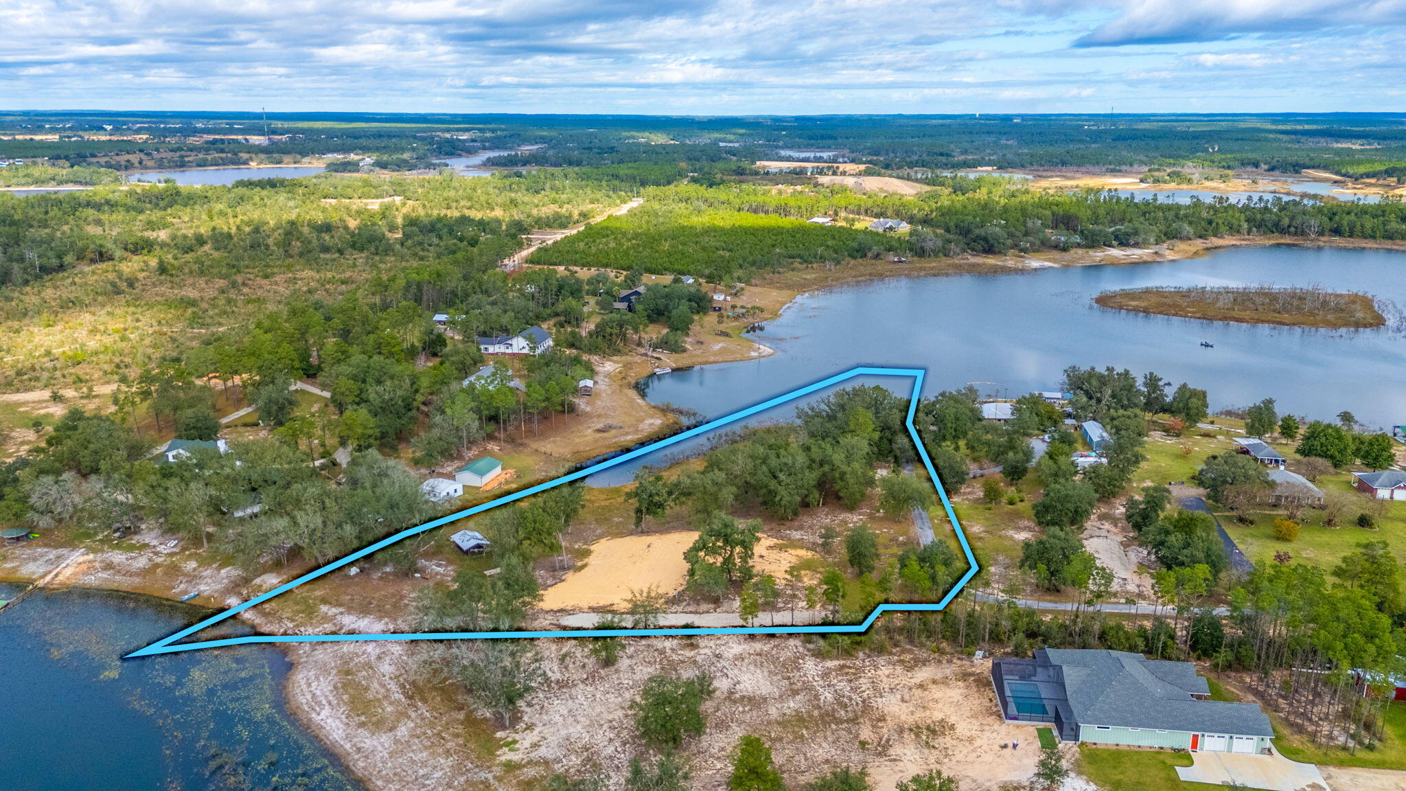 Ever dreamed of waking up to water views from both your front and back porch? This exceptional 3.96-acres makes that dream possible! Uniquely positioned between two lakes, this vacant land offers waterfront views on both its north and south boundaries.This rare gem comes ready for you to start building right away. The current owners have already taken care of the heavy lifting by installing underground utilities and preparing the foundation dirt for your future home.  Don't miss this opportunity to build your dream home in this special location where nature provides a spectacular show from every angle. The hardest decision you'll have to make is which lake view you love more! Call today to see this unique double-waterfront property - it's a rare find that won't last long in the market