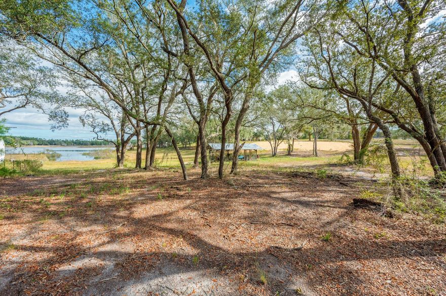 Ever dreamed of waking up to water views from both your front and back porch? This exceptional 3.96-acres makes that dream possible! Uniquely positioned between two lakes, this vacant land offers waterfront views on both its north and south boundaries.This rare gem comes ready for you to start building right away. The current owners have already taken care of the heavy lifting by installing underground utilities and preparing the foundation dirt for your future home.  Don't miss this opportunity to build your dream home in this special location where nature provides a spectacular show from every angle. The hardest decision you'll have to make is which lake view you love more! Call today to see this unique double-waterfront property - it's a rare find that won't last long in the market