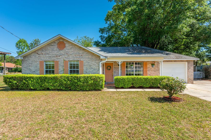 You don't want to miss this all brick 3 bedroom and 2 bath home located in the heart of Crestview on nearly .60 acres of land! Enter the front door to see vaulted living rooms ceilings, fresh paint with laminate and tile flooring throughout, granite counter tops with extended breakfast bar, and a Florida room! Painted kitchen cabinets, new hardware, new faucet and sink with a pantry and shelving. Bedrooms have ceiling fans and bathrooms have new toilets. There's a 15x24 workshop with electricity that has a side barn door and the front porch is covered with a swing for relaxation. Additional water spigot next to shed. There's 2 additional sheds and one can be used for planting. Backyard is completely fenced in with a chain link fence.