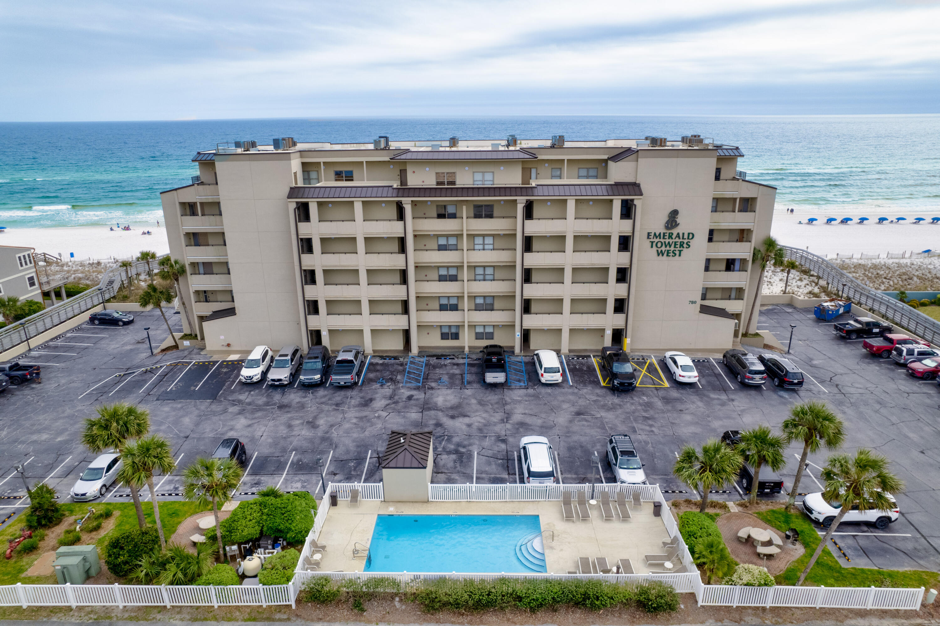 Enjoy the rare opportunity to own this lovely 3 bedroom 3 bathroom condo on beautiful Okaloosa Island. Emerald Towers West is a Gulf front low density condo complex with only 44 units. Sweeping views of the Gulf can be enjoyed from inside or on the private balcony. Each of the three bedrooms serves as a private retreat, featuring comfortable bedding and an en suite bathroom for maximum privacy and convenience. The primary suite enjoys direct balcony access, offering an intoxicating view of the Gulf to wake up to every morning. Recent upgrades include all new LVP flooring, new kitchen cabinets and countertops, new bathroom vanities and new living room furniture.This condo has been a successful vacation rental, but could also make a wonderful first or second home