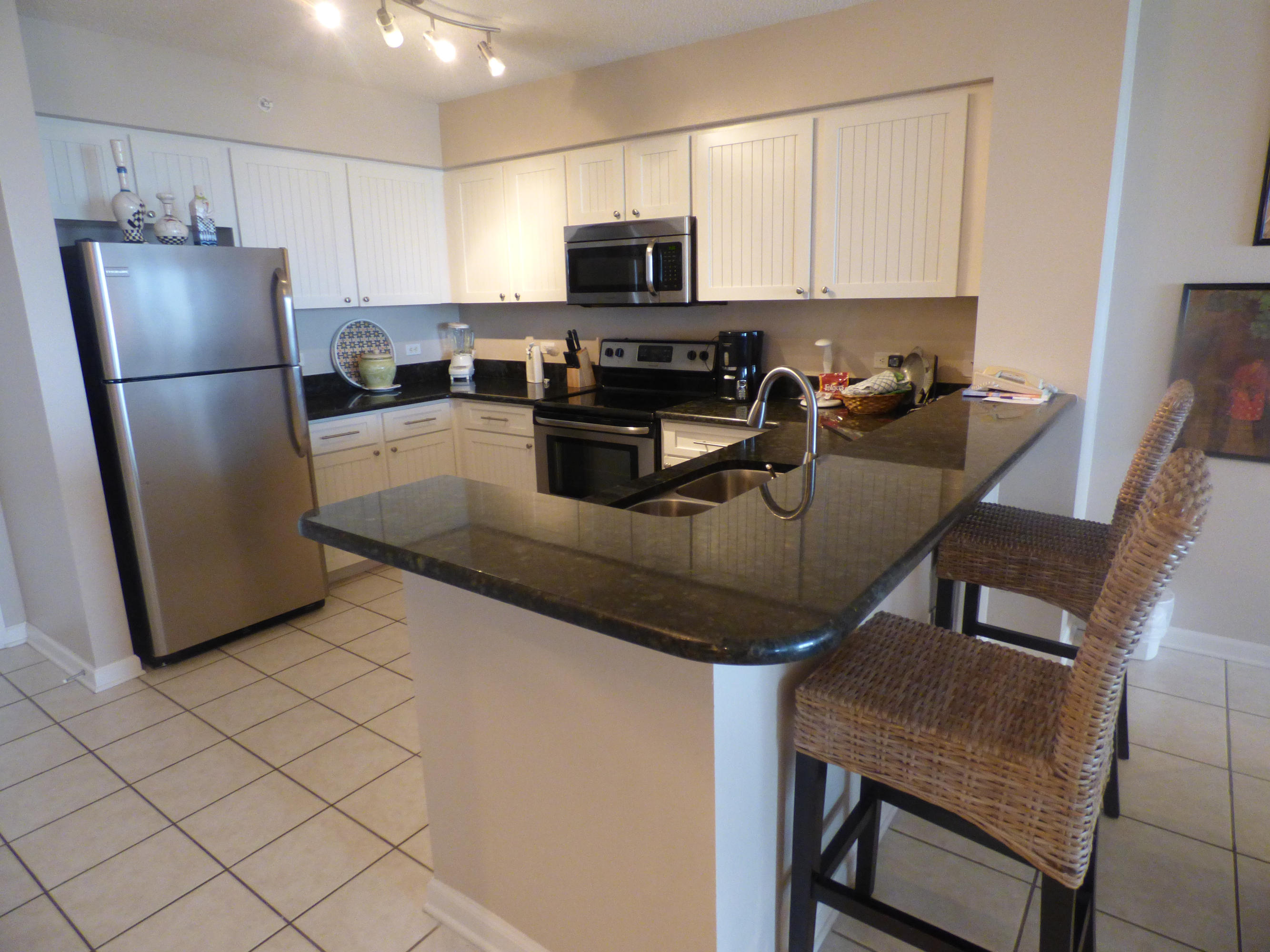 Gorgeous condo in the perfect location on the 9th floor. This unit has several updates including granite in the kitchen,stainless steel appliances and new cabinet doors. Baths have updated cabinets w/granite tops and large tile. Unit comes completely furnished and is turn-key ready to go. The views from the Terrace in this location will not disappoint. They are awesome. Snowbirds return here year after year. Amenities include a gym, beautiful heated pool, spa and 3 community rooms for socializing, weddings and group meetings. We have a cross easement with Pelican Beach Resort to use all of their facilities as well.Photos of birds on beach above sofa in living area do not convey as well as the pair of prints hanging above the bed in the master and small Asian floral print in the master.