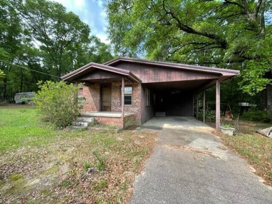 Fantastic RENTAL / INVESTMENT OPPORTUNITY! 3 bedroom 2 bathroom  ALL BRICK home with metal roof carport and two driveways. Enjoy the mature trees trees lining 
this deep lot +/- 0.25 acre lot for that feeling of privacy. Enjoy a short walk to Twin Hills Park where there's a track to jog and walk your dogs around the lovely pond. Nestled in the heart of Crestview with quick access to both Hwy 85 and Hwy 90. This 3 bedroom, 2 bath home is ready for you to update and renovate to get that rental income flowing. Act now before your opportunity at this well priced property is gone. Schedule your showing today!