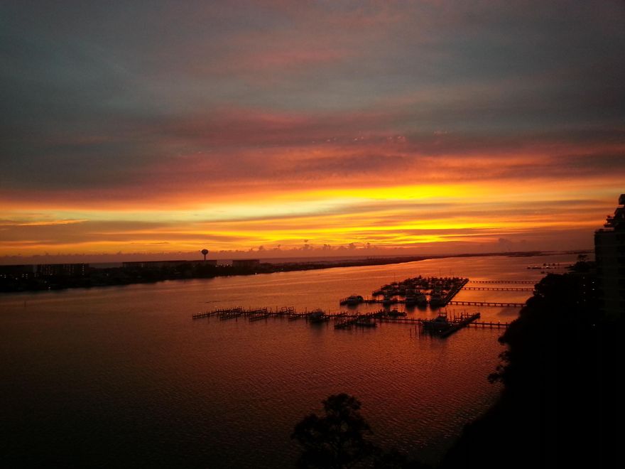 Superb open waterfront view of Gulf and Santa Rosa Sound. Sunsets, and a clear view of the undeveloped portions Santa Rosa Island. From this upper floor unit, you can see all the way to Navarre Beach and beyond. Great view of the Gulf and Beach. Common amenities include pool, spa/hot tub, and sun-deck, exercise and gym room, surround sound theater room. Private boat slip(s) (can be purchased as an extra, not included in listing), private guest suite available to residents, association room available to host receptions and meetings. Wide quite private interior entry halls. All entries secured by entry codes.