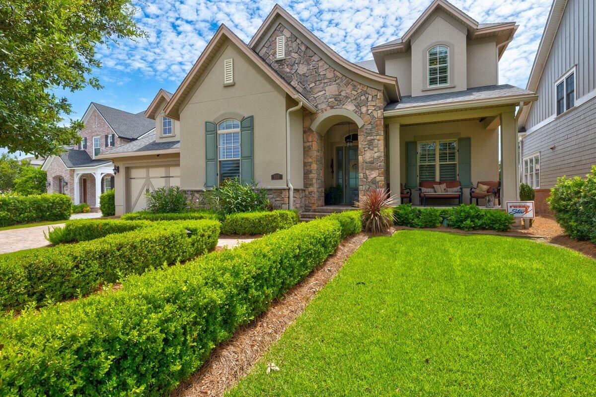 265 Champion Court is a custom-built French Country style home that must be seen in person to truly appreciate all the features and details it offers. Overlooking two lakes and the 18th fairway at Kelly Plantation, it provides beautiful views and well-manicured  landscaping. It boasts a maintenance free stone and stucco exterior. Hickory wood floors and stairs greet you upon entry. The open kitchen / great room floor plan is great for entertaining. The master bedroom and guest bedroom are Located downstairs and there are two more bedrooms and a large bonus room upstairs. The home is loaded with energy saving features and the latest in audio/video technology. Iceane insulation on the roof deck, R-19 wall insulation, Rinnai hot water heater w/ circulating loop, Energy Star windows with