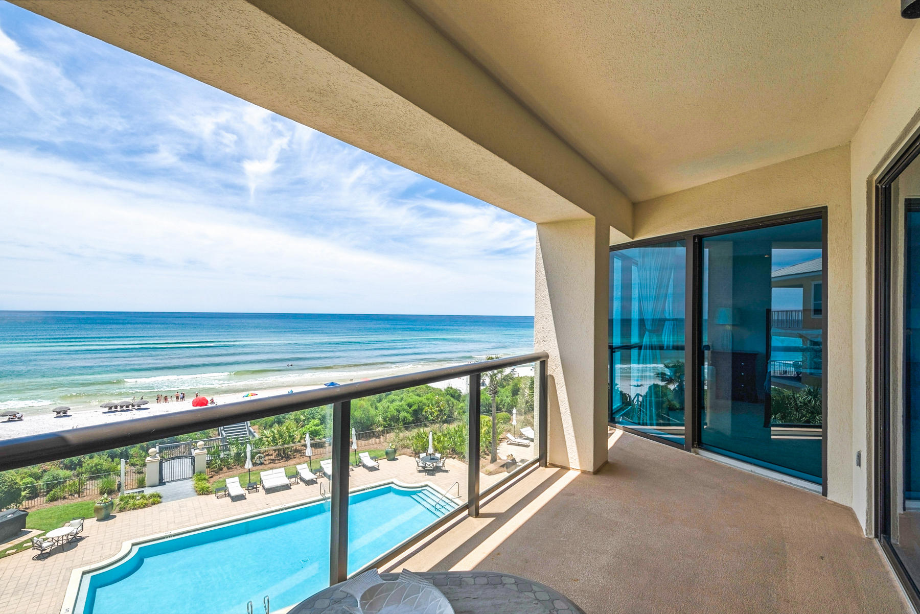 Designed to be a private retreat, Park Place is the ultimate, luxury, beach front address along the beautiful beaches of 30A. Park Place features stunning architectural detail by William Blackstone Architects, with luxurious upgrades on one of the largest units in the complex. This rare, non-rental unit has all the warmth and character of other units in the area but with a contemporary flair.Upon arrival, you are greeted by the wrought-iron gated entryway, bordered by white stone columns and a tall, thick hedge, giving a well defined boundary along the perimeter of the property. Landscape architect Nimrod W. E. Long III has designed the grounds so the parking accommodations are hidden by the lusciously maintained vegetation.