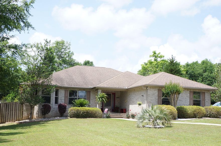 Beautiful custom home with side-entry double car garage is ready and waiting for you. This home features a large open deck in the privacy fenced back yard, complete with a covered bench swing and a great covered sitting area with ceiling fans. The interior of the home is loaded with extras; bull nose corners, raised ceilings. Crown molding trim, new light fixtures/fans, and six-inch baseboards. The great room boasts an open shelf entertainment center that can accommodate a 60'' TV. The kitchen has been recently upgraded with quartz counters, all new stainless appliances and a built-in china hutch. The spacious master suite has new carpet, trey ceiling, fan and a large master bathroom with separate vanities, corner garden tub, separate shower, and 2 walk-in closets.
